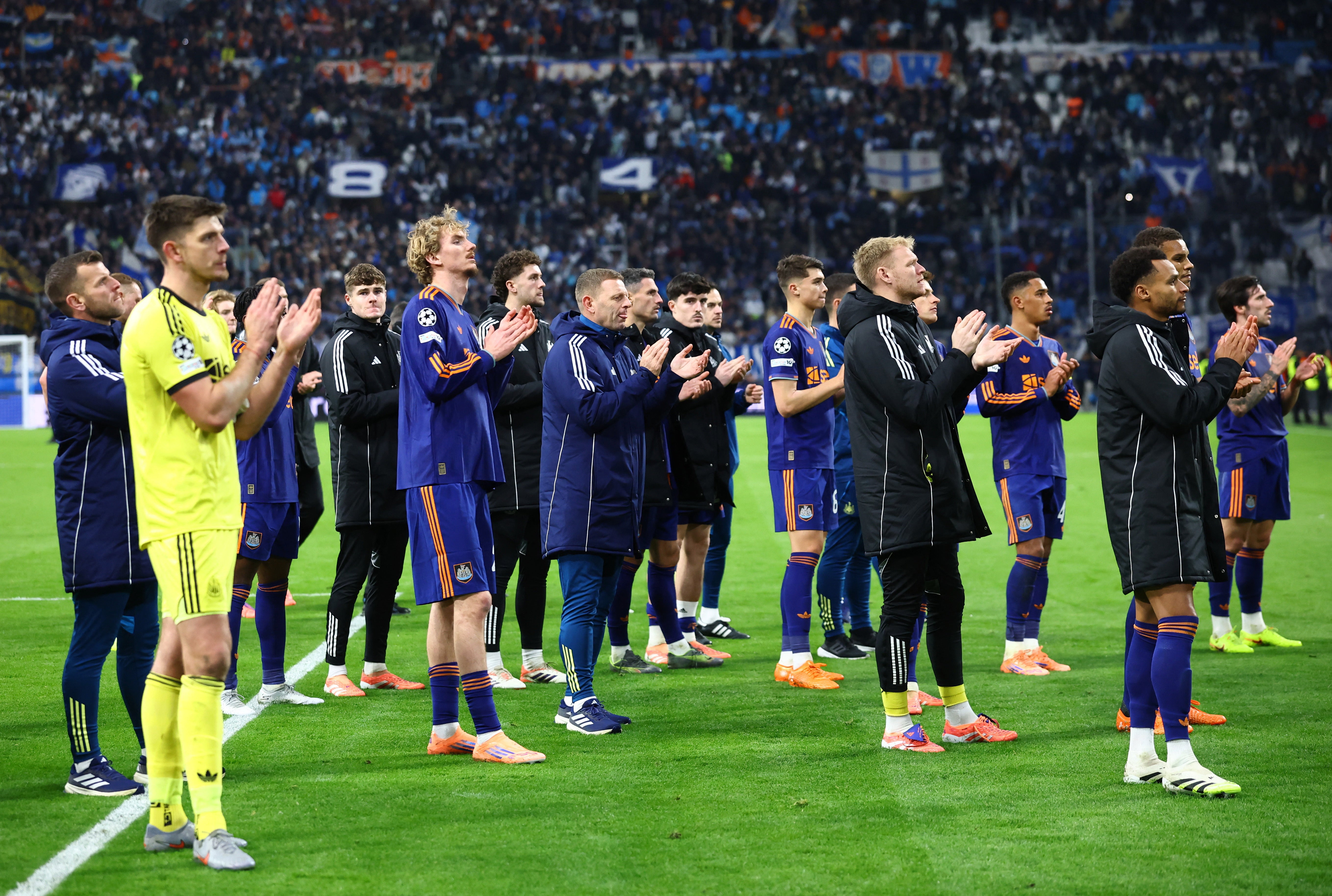 Newcastle players applaud their fans at full-time