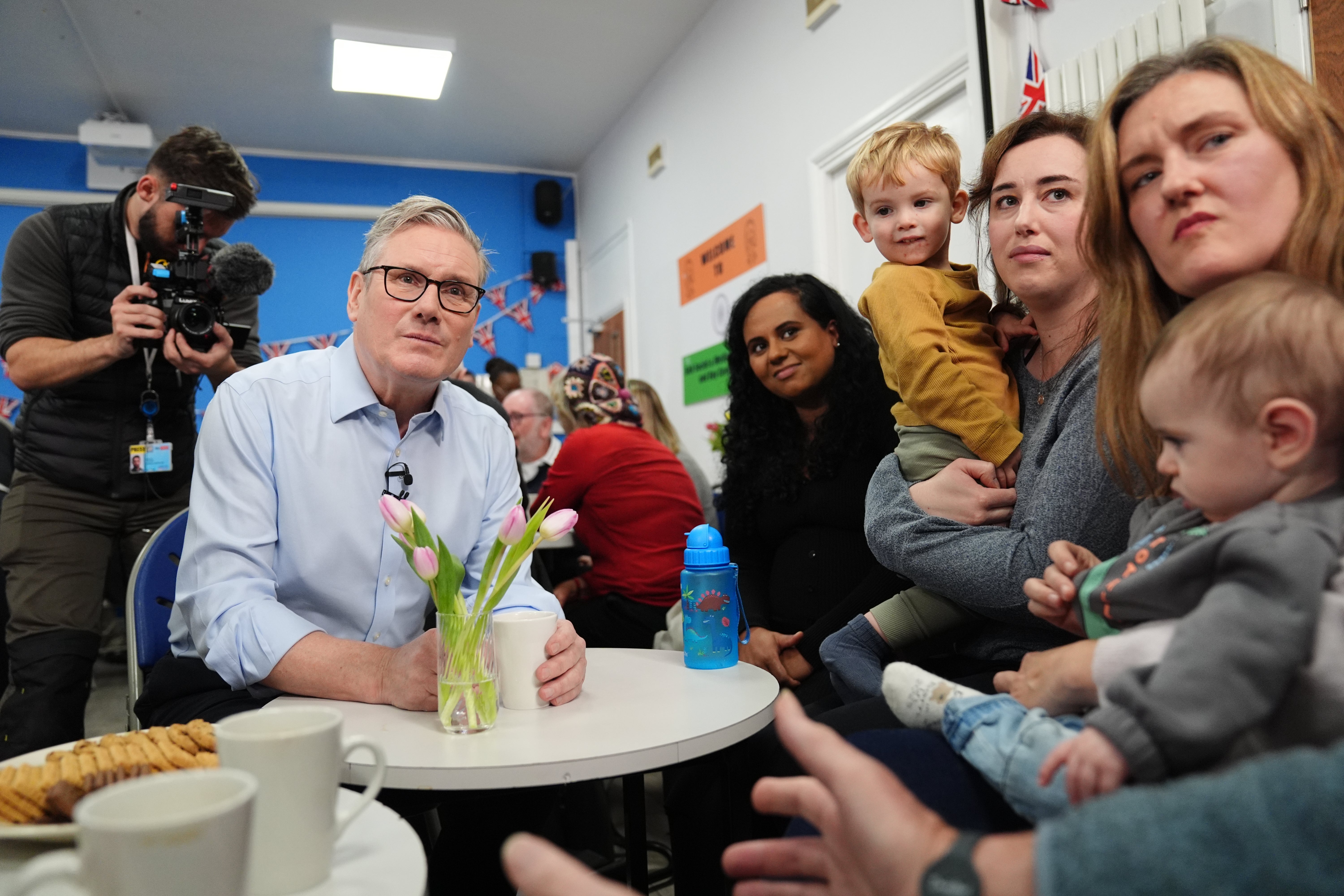 <p>Prime Minister Sir Keir Starmer speaks with guests during a visit to the Benn Partnership Centre, a community centre in Rugby, Warwickshire </p>