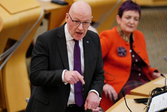 <p>First Minister John Swinney branded protests outside asylum seeker hotels ‘racist’ (Jane Barlow/PA)</p>
