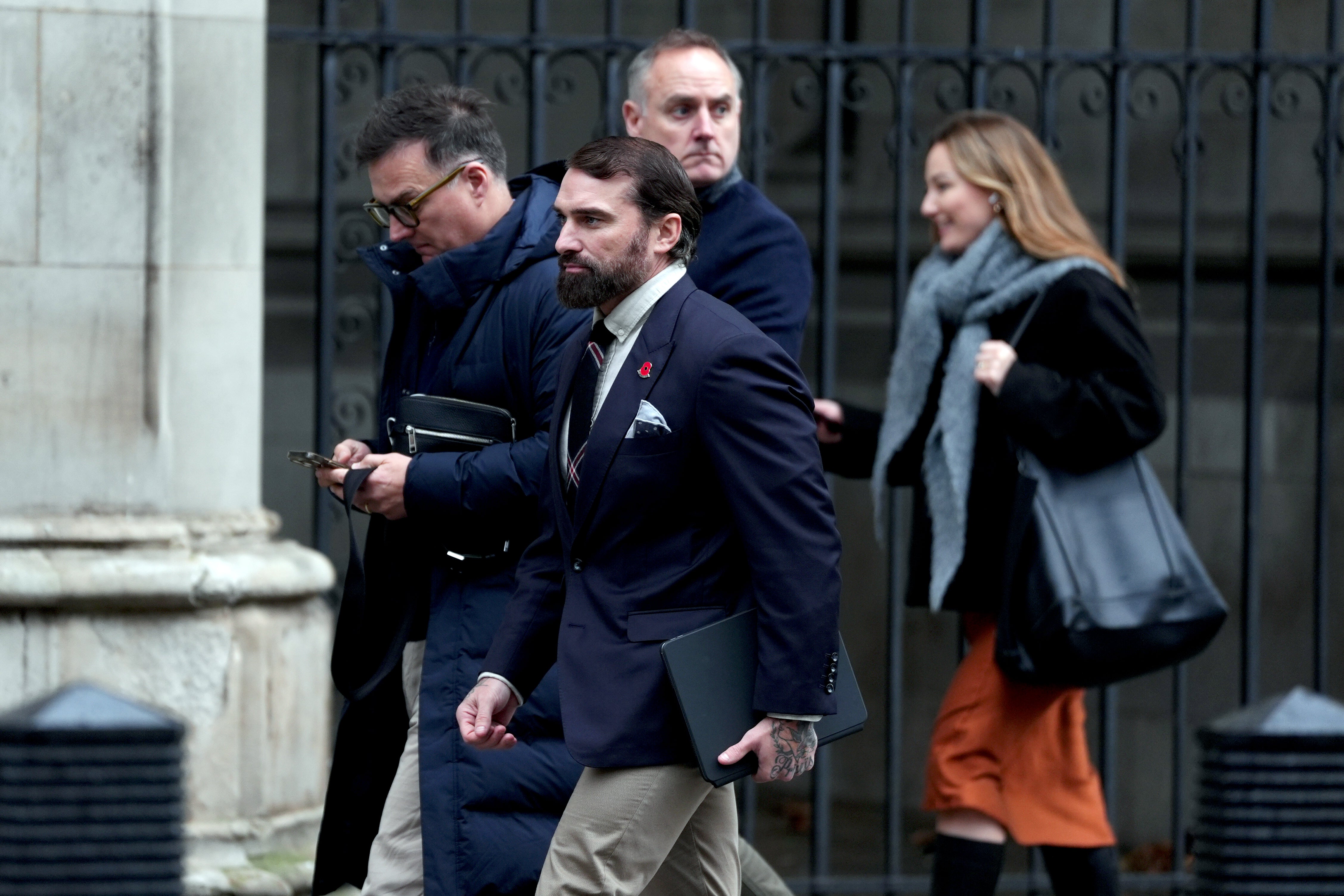 Television personality Ant Middleton (second left) outside the Royal Courts of Justice, central London, where he is being sued by the Ministry of Defence (MoD) over an alleged breach of contract. Court records show that the MoD issued a legal claim against Mr Middleton, who presented Channel 4's SAS: Who Dares Wins. Picture date: Thursday November 27, 2025. PA Photo. Photo credit should read: Ben Whitley/PA Wire
