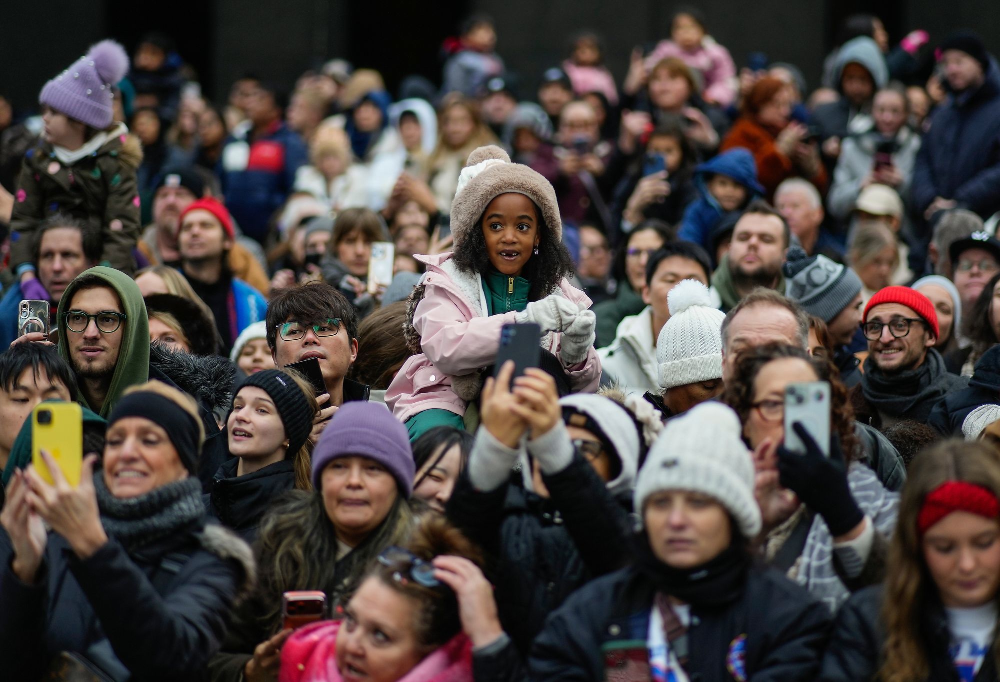 Spectators watch the 2025 Macy's Thanksgiving Day parade