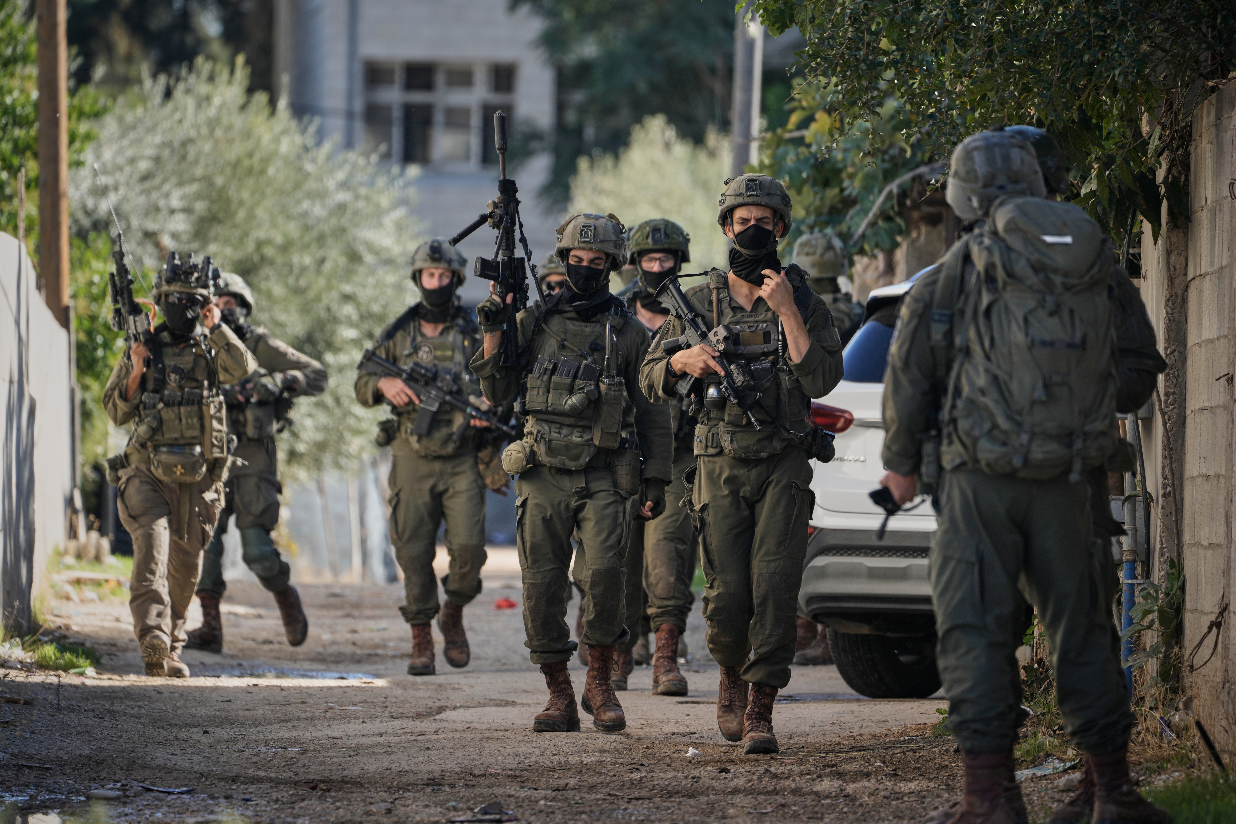 Israeli soldiers are seen during an army raid in the West Bank town of Tubas on 26 November