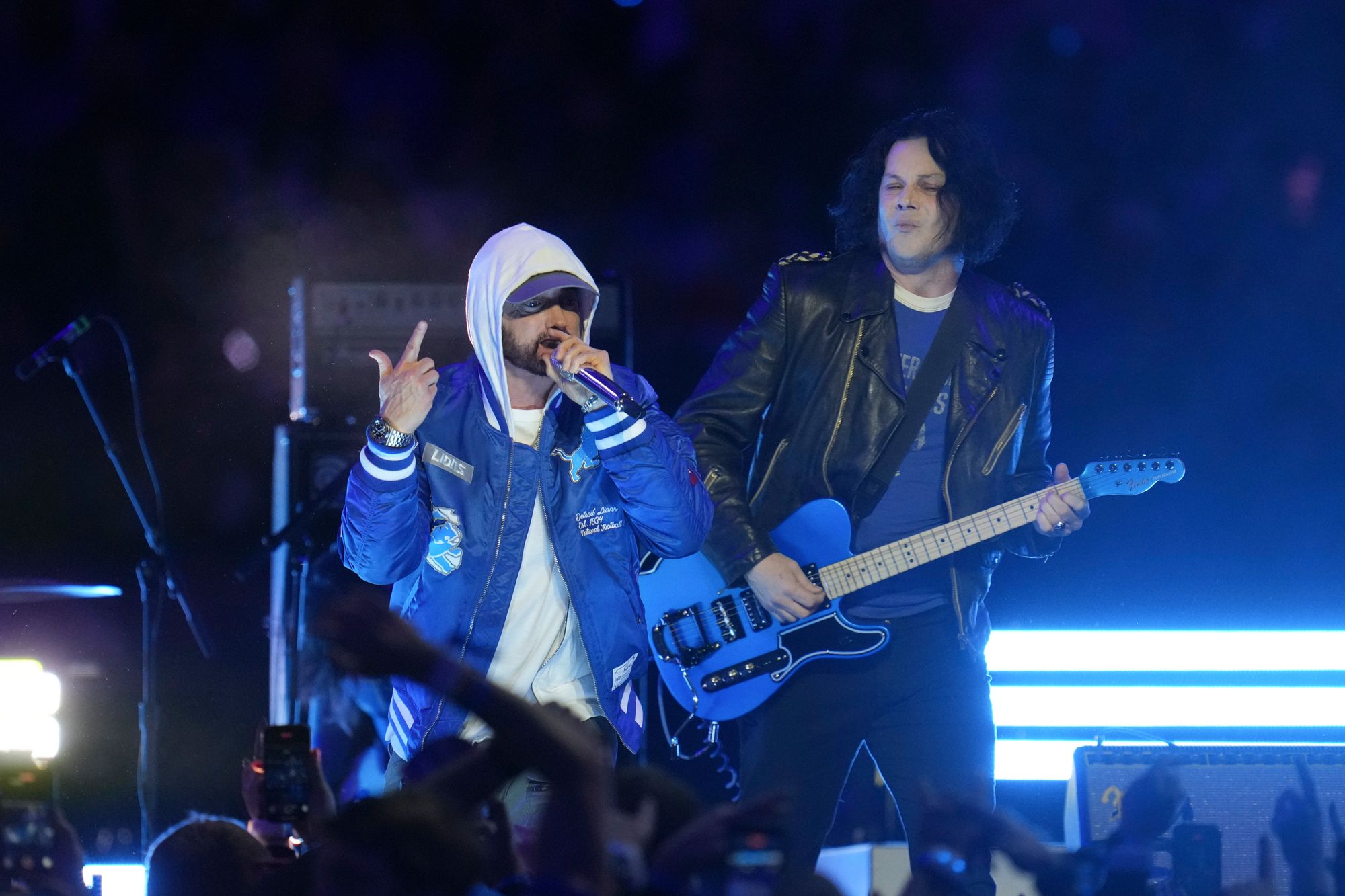 Few expected Eminem to make an appearance onstage but he later came out alongside headliner Jack White, another Detroit local, wearing a Lions jacket and white hood pulled up over his head