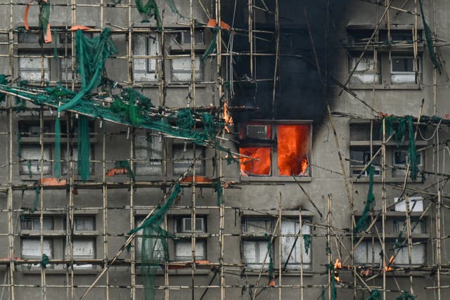 <p>Apartments still burn as a major fire swept through several apartment blocks at the Wang Fuk Court residential estate in Hong Kong's Tai Po district </p>