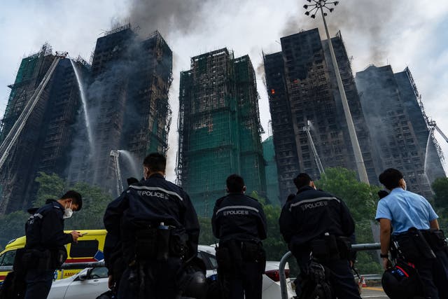 <p>Firefighters work to extinguish the fire at Wang Fuk Court in Hong Kong on Thursday</p>