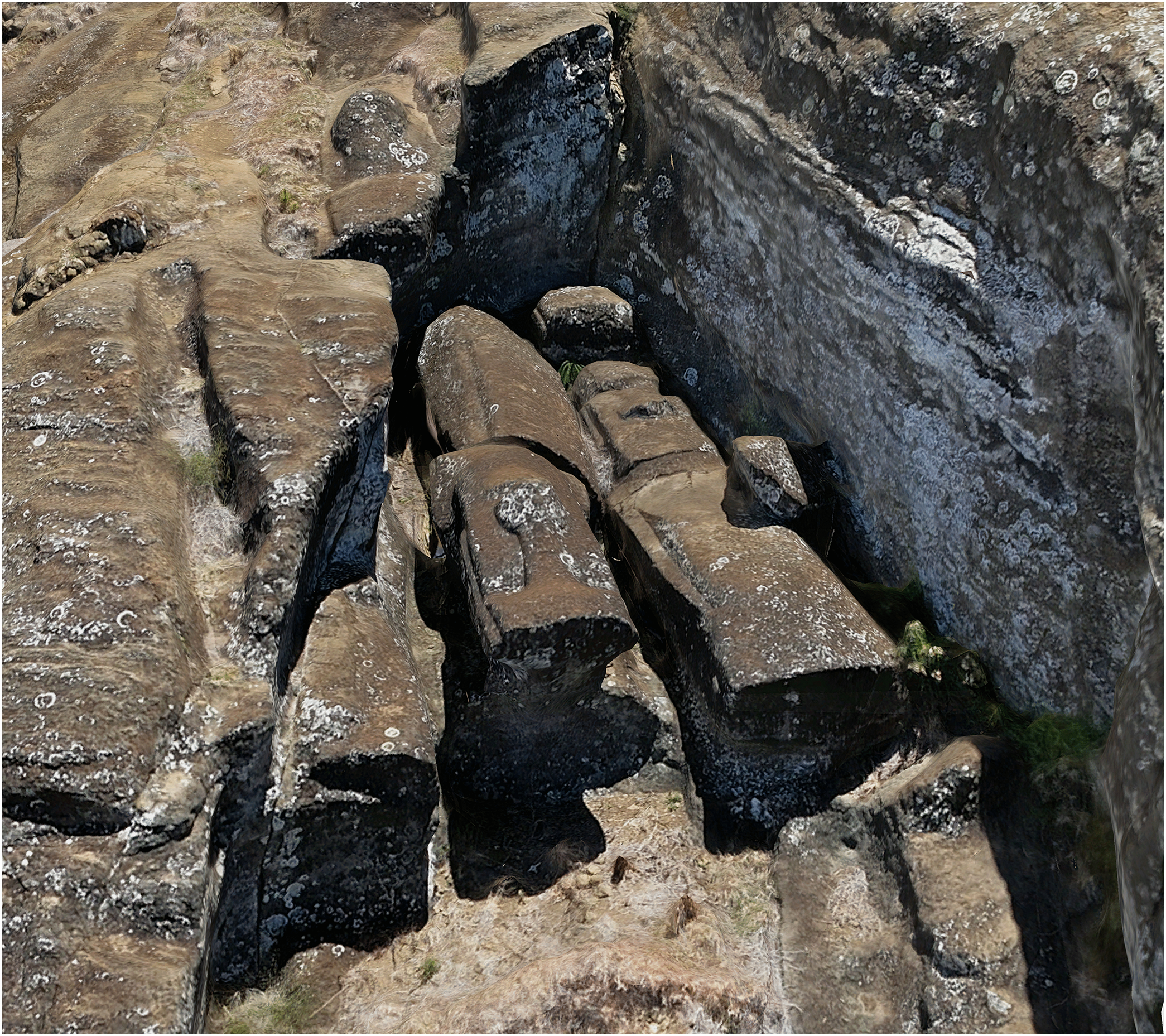 Unfinished Moai attached to bedrock by 'keels' along their backs