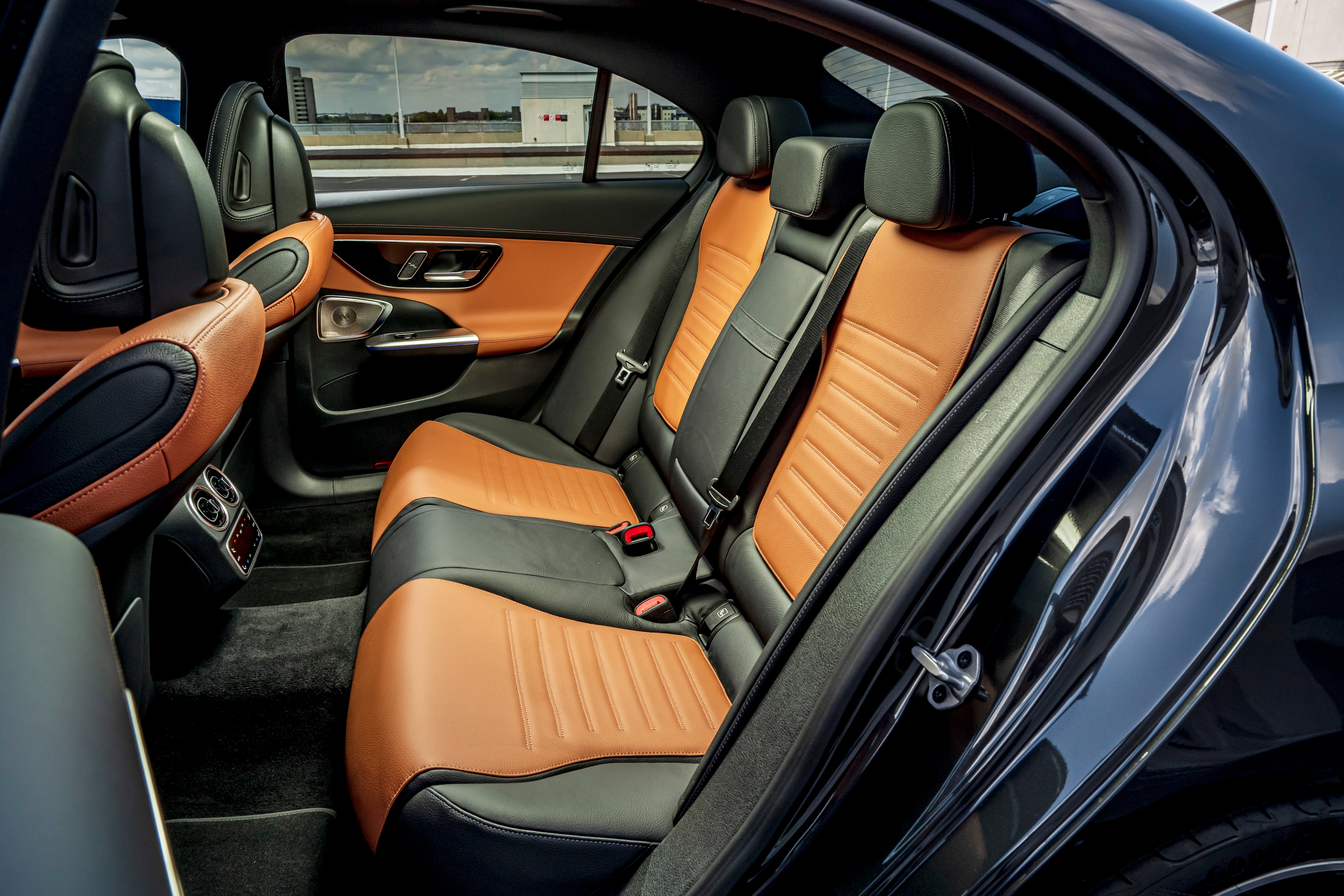 The back seat is best reserved for two people rather than three because of the ultra-wide central tunnel