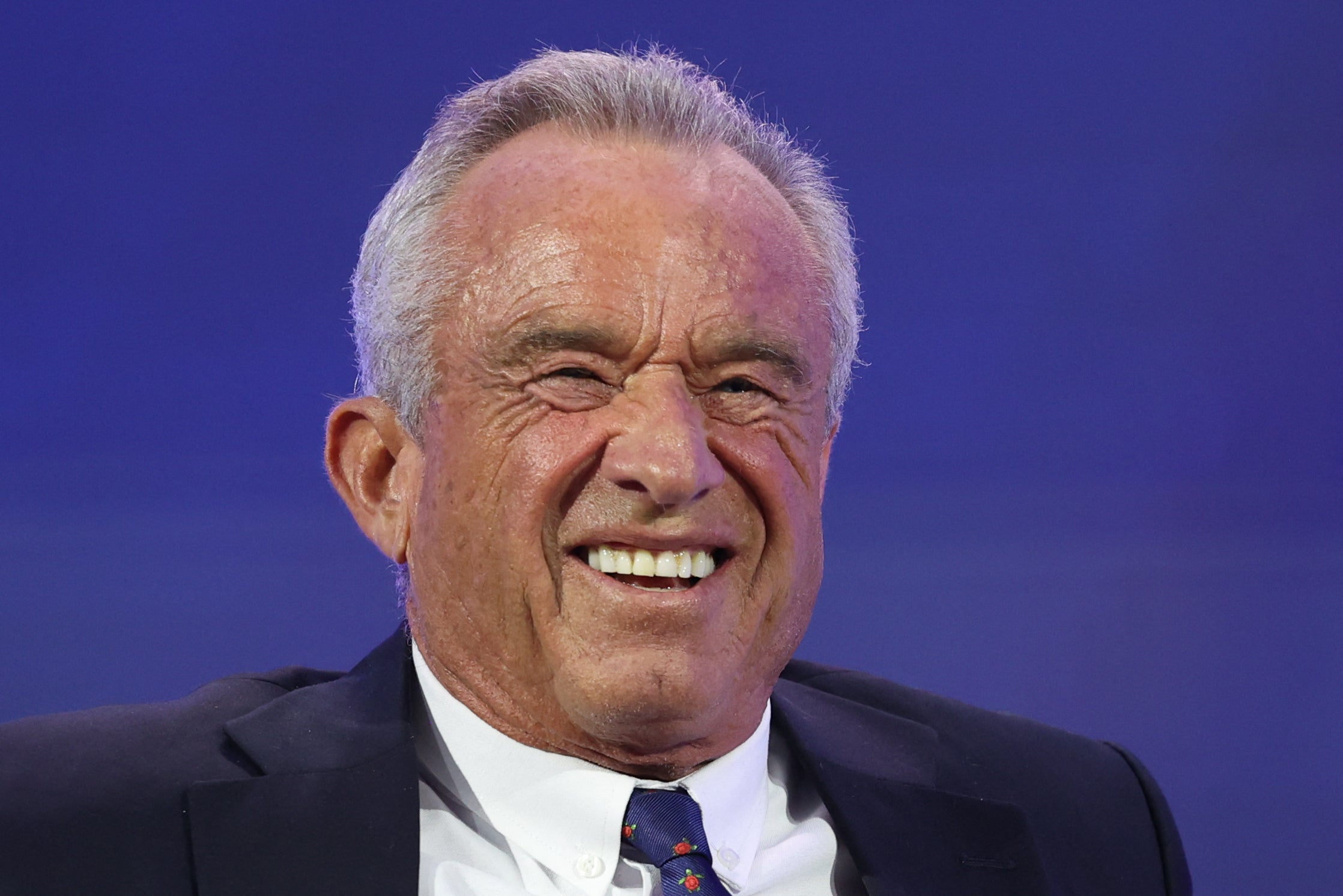 <p>Health and Human Services Secretary Robert F. Kennedy Jr. was ridiculed online after he posted a photoshopped image of himself, President Donald Trump and other allies enjoying a Thanksgiving feast</p>