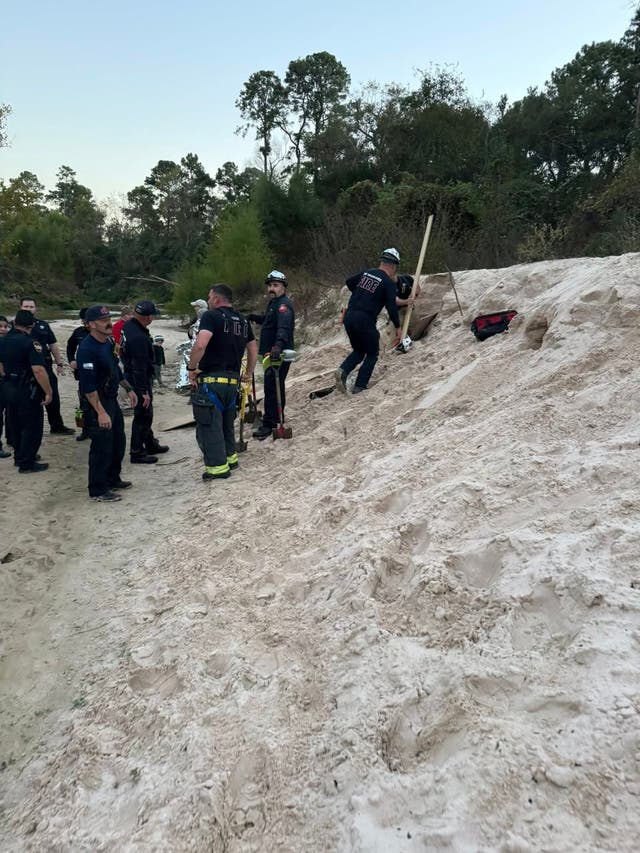 <p>First responders at the scene after a 12-year-old trapped in a sand hole in Texas</p>