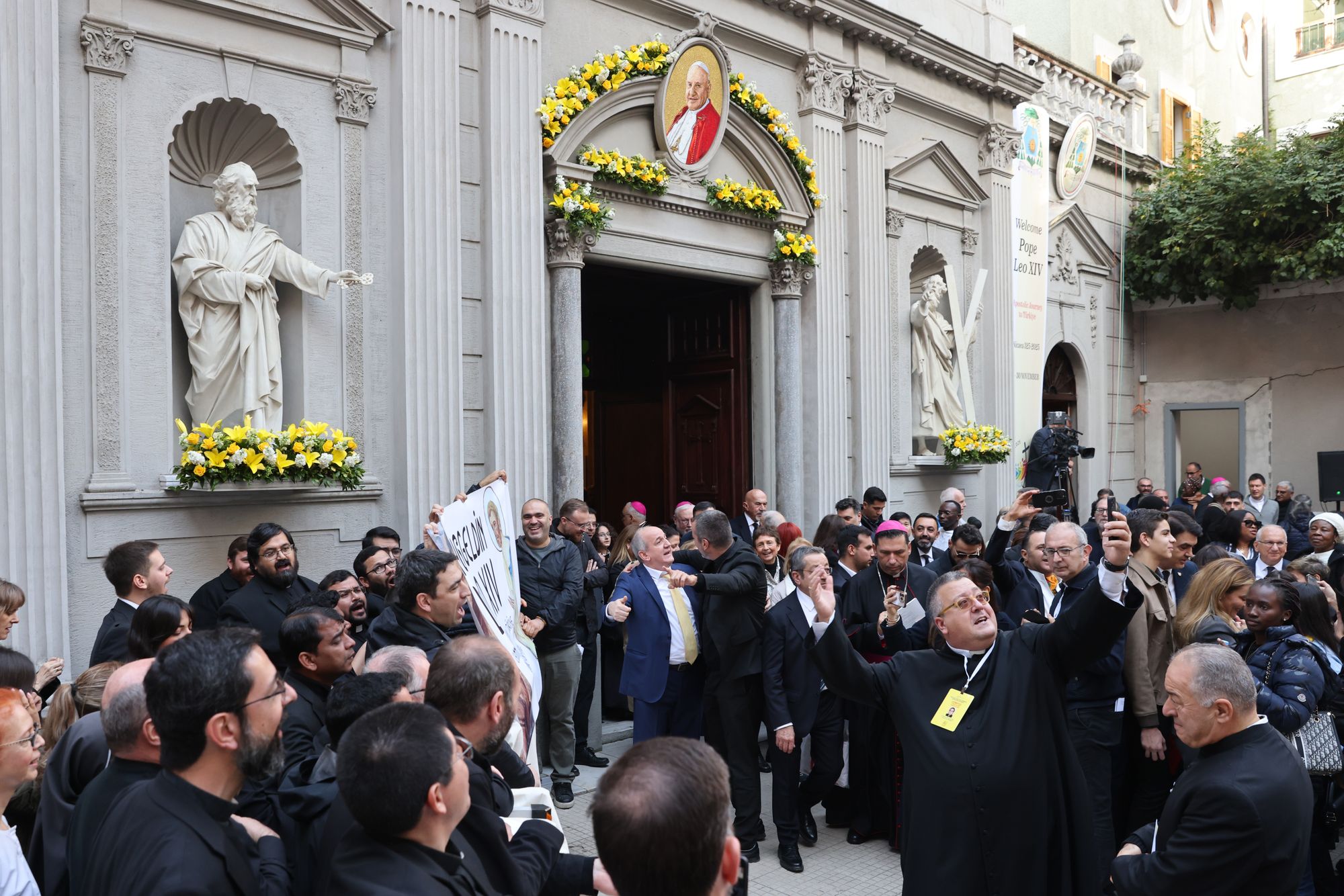 The Faithful gather, waiting for the departure of Pope Leo XIV from the Cathedral of the Holy Spirit, following a meeting with members of the clergy and lay people