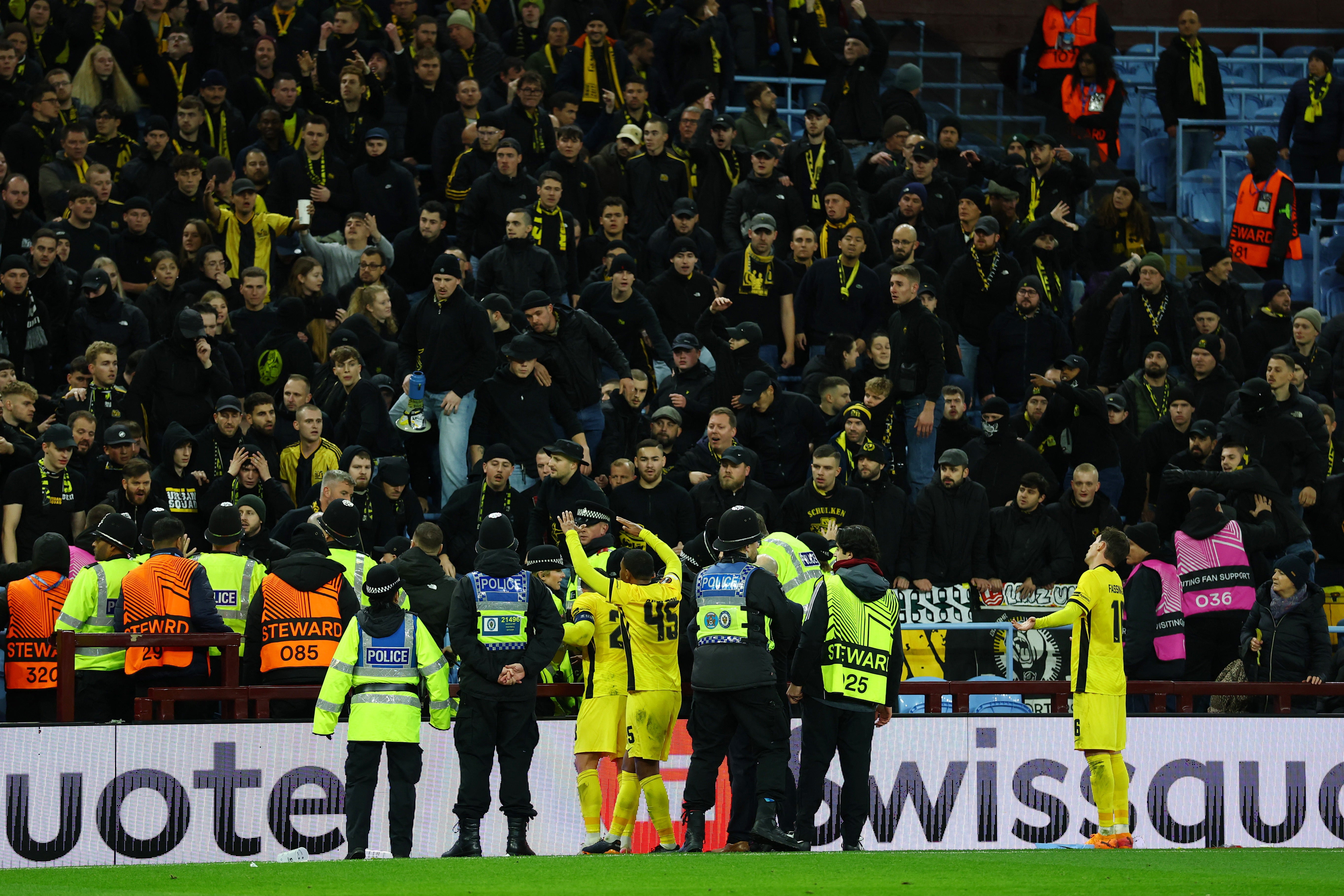 Supporters of Young Boys clash with police and stewards in the stands after Aston Villa's Donyell Malen scored their second goal as players of the Swiss club appeal for calm