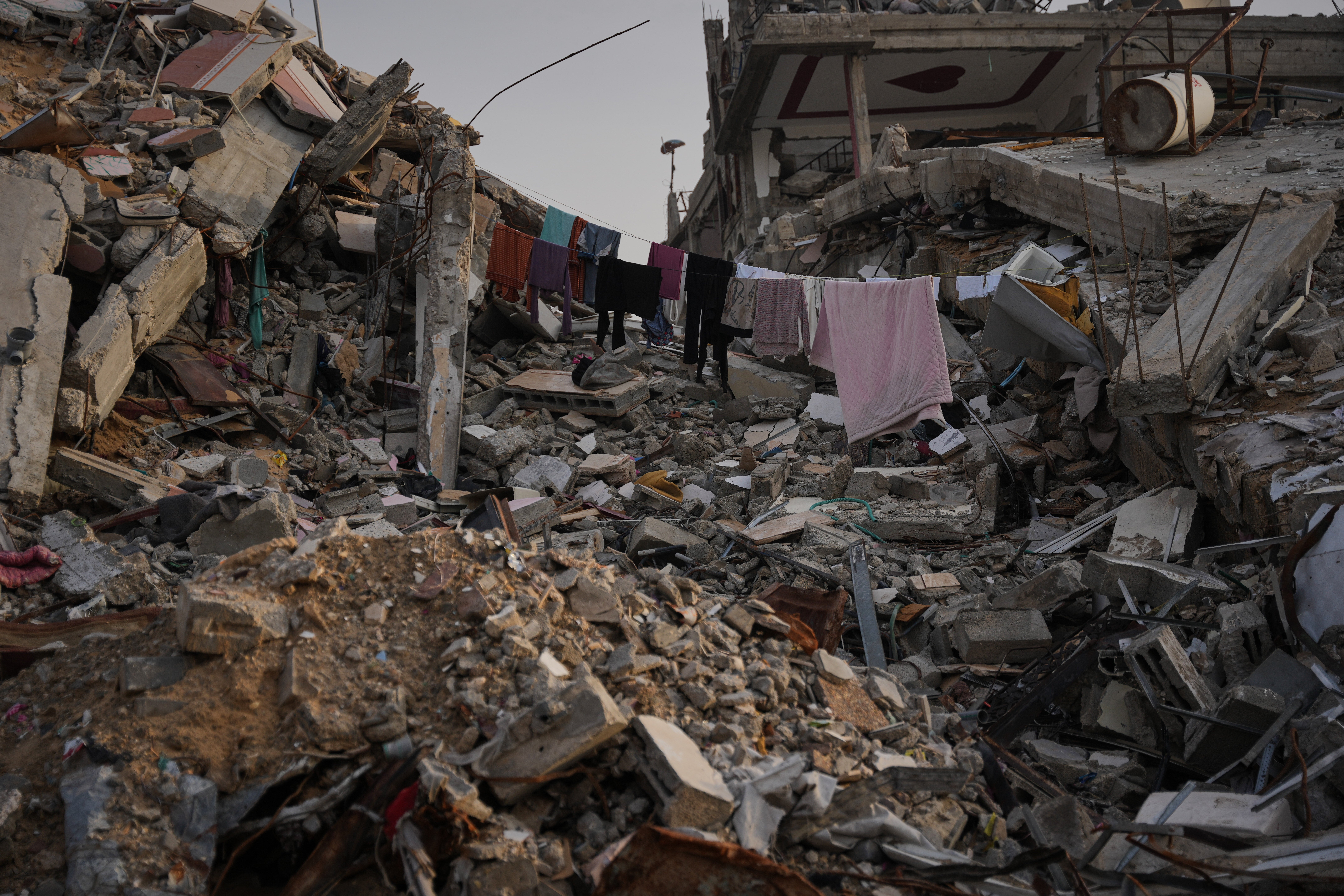 Laundry hanging between the rubble left behind by Israeli air and ground offensive in Gaza City on Saturday November 29, 2025