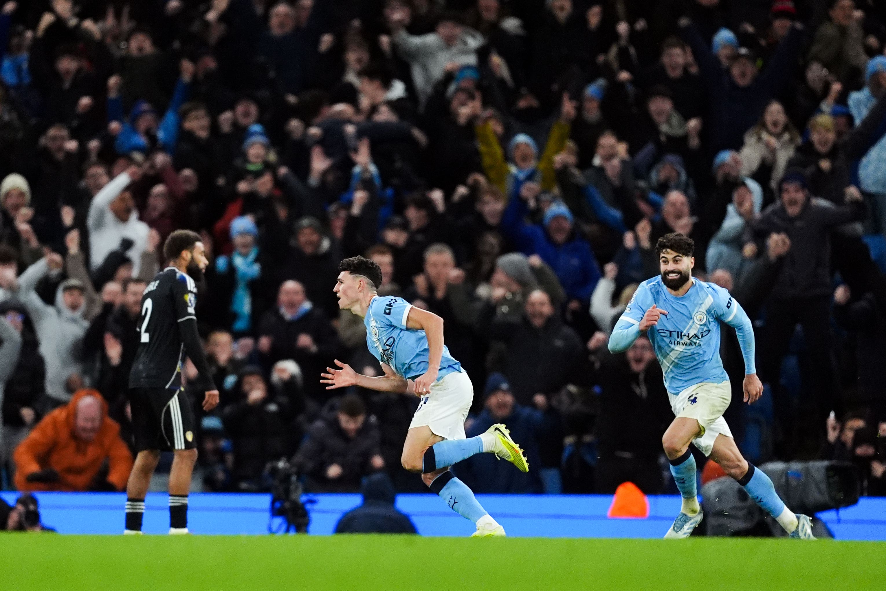 Phil Foden celebrates the winning goal in added time (Martin Rickett/PA)