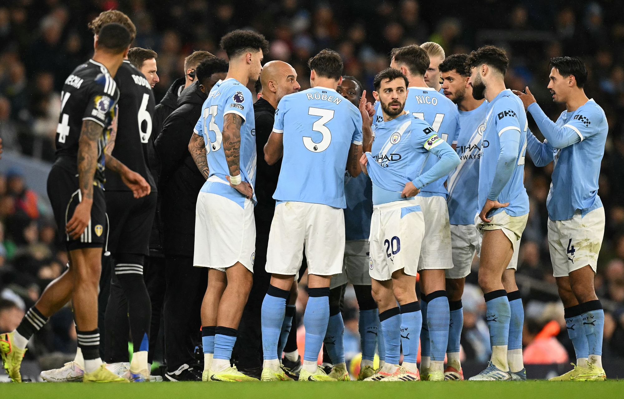 Guardiola spoke to his players while Donnarumma received treatment