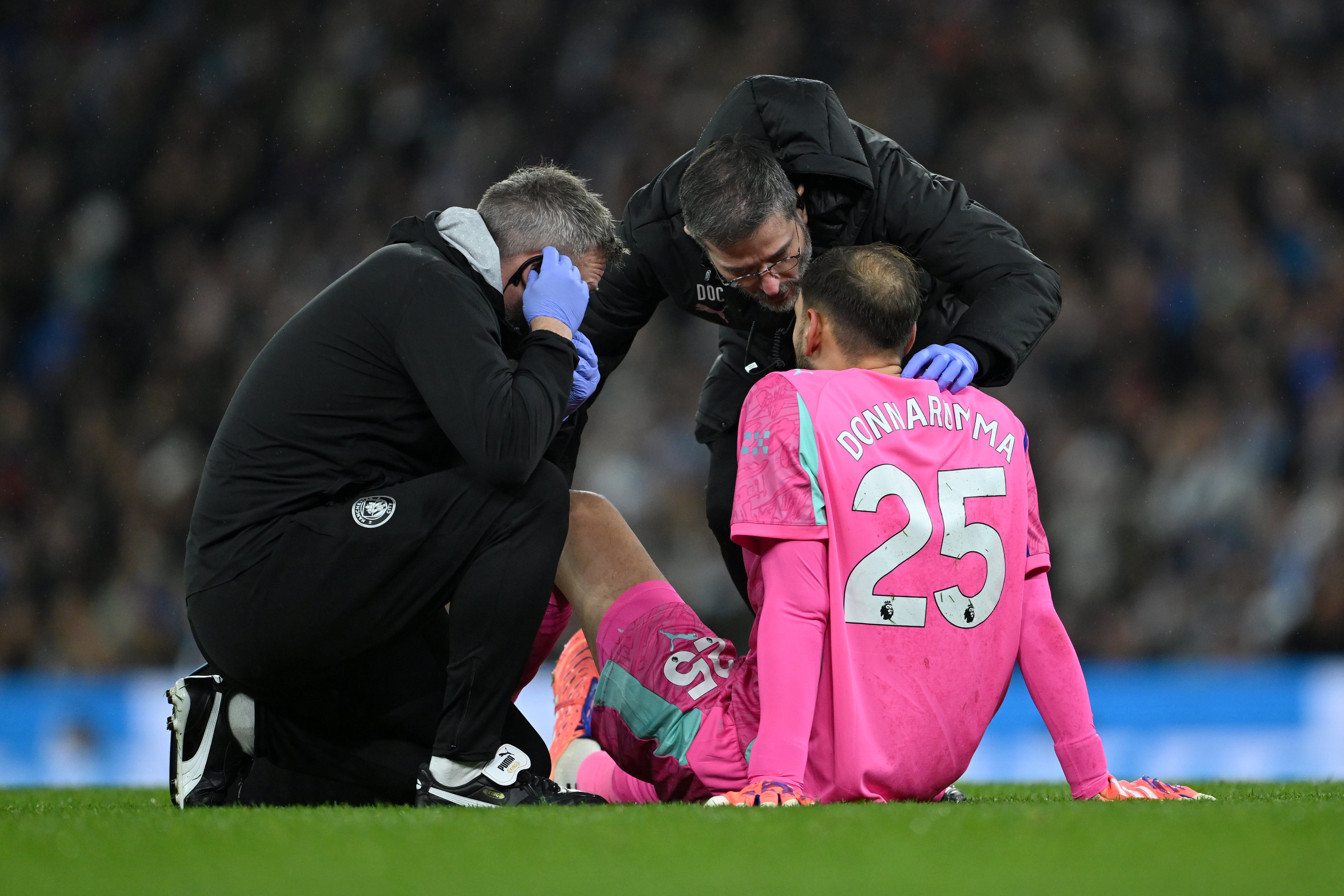 Goalkeepers remain on the pitch while they receive treatment, unlike with outfield players