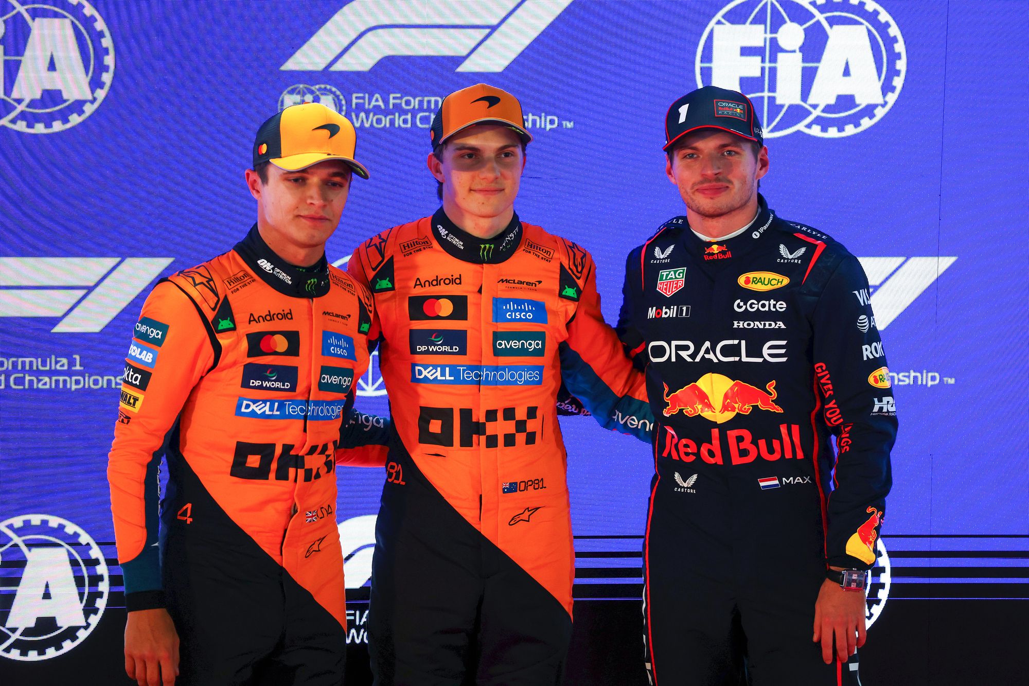 Oscar Piastri (centre) is on pole with Lando Norris (left) in second and Max Verstappen (right) in third
