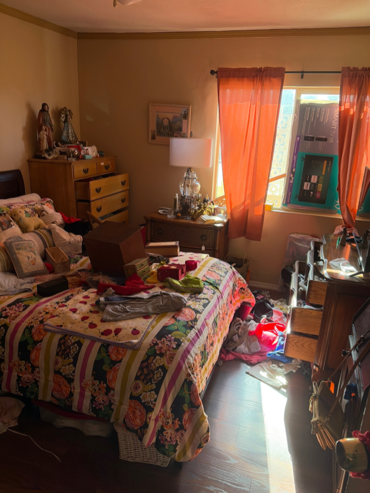 Inside, it appeared the home had been burglarized. Clothes were strewn across the floor, drawers yanked open and emptied, and a shattered window marked the intruders’ point of entry