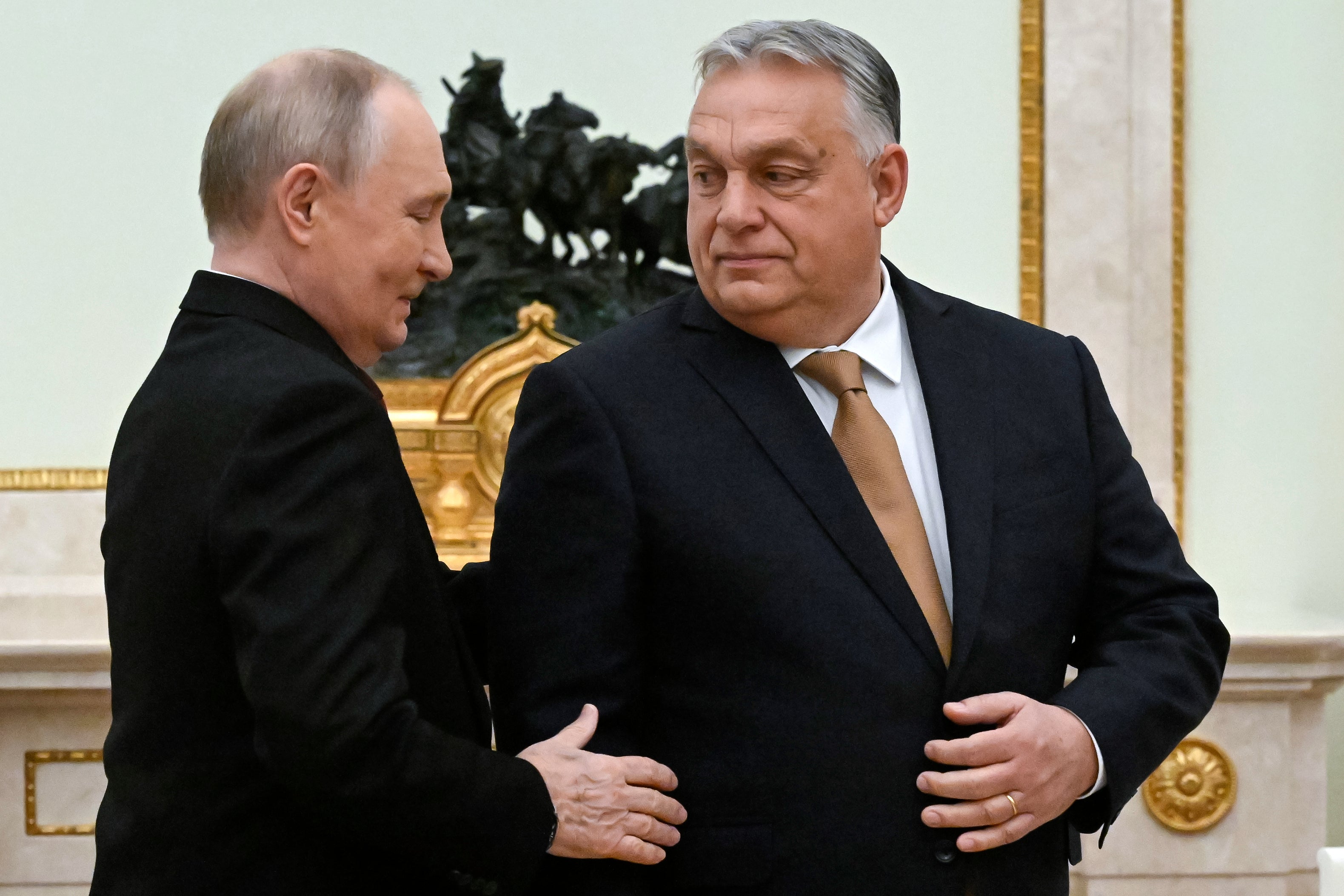 Russian President Vladimir Putin, left, speaks with Hungarian Prime Minister Viktor Orban during their meeting at the Senate Palace of the Kremlin in Moscow