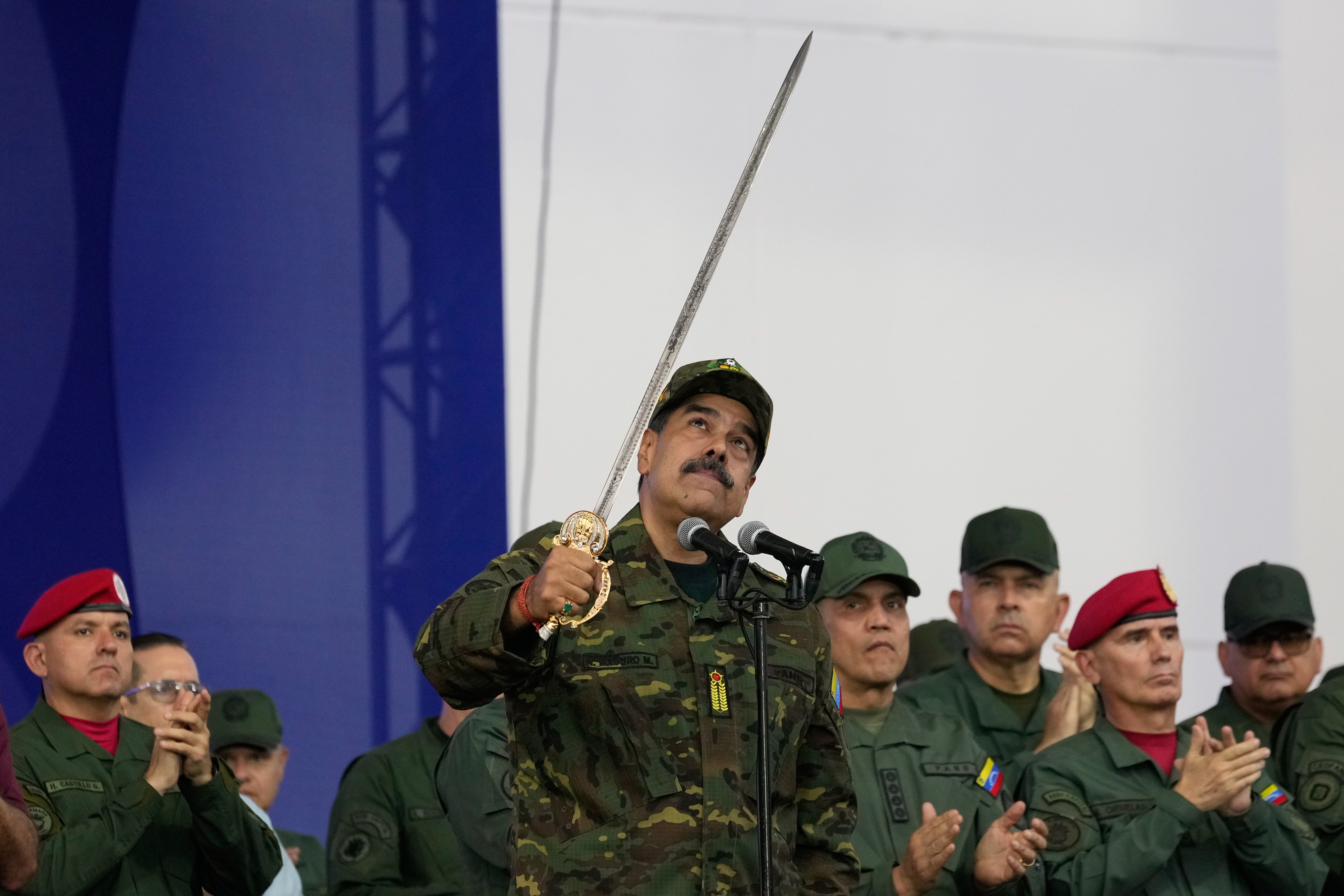 Venezuela’s Nicolas Maduro brandishes the sword of Simon Bolivar. His government has remained defiant in the face of U.S. threats of military action inside his country