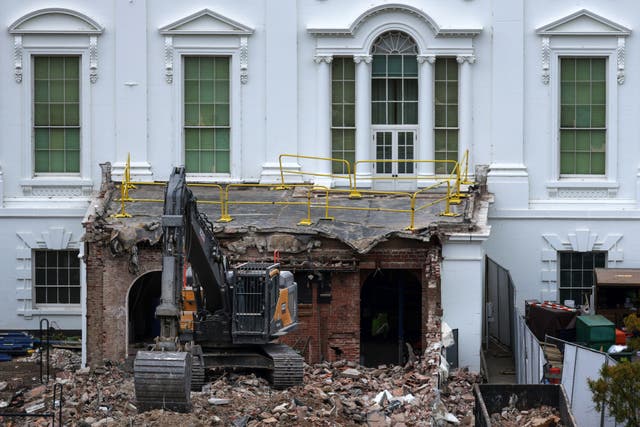 <p>An excavator sits on the rubble after the East Wing of the White House was demolished</p>
