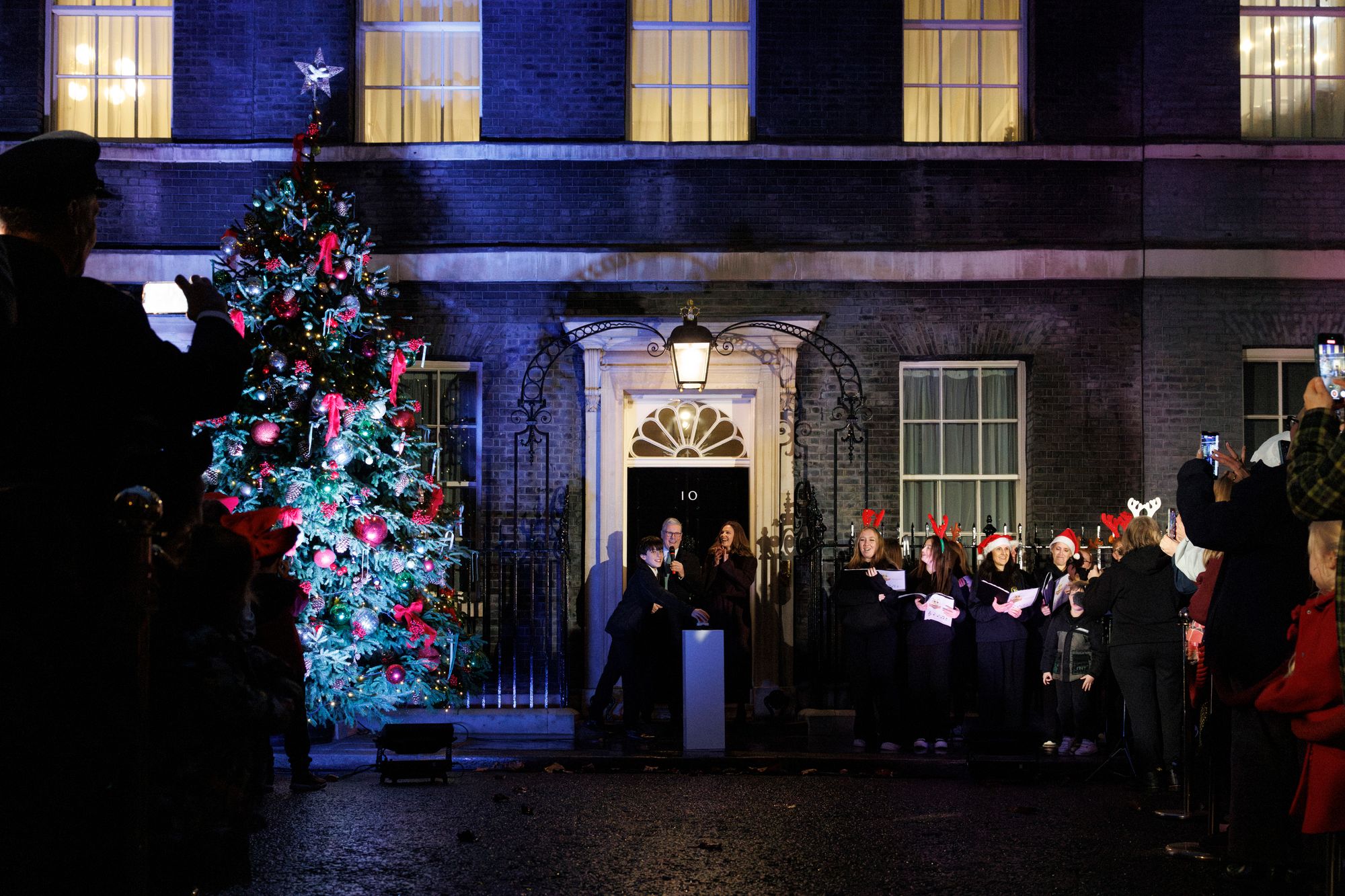 <p>Sir Keir Starmer turns on the Christmas tree lights outside 10 Downing Street</p>