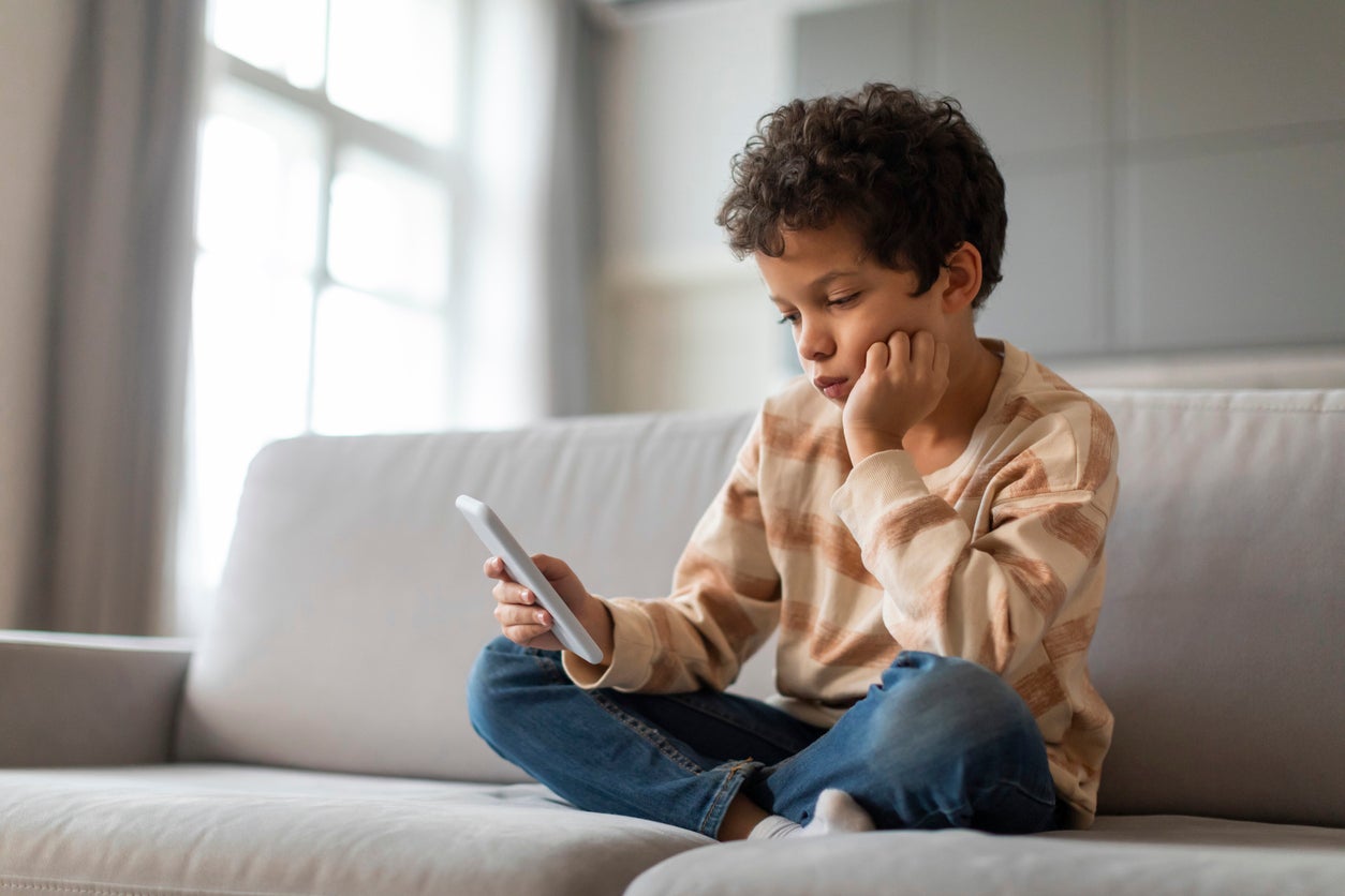 Kids with a smartphone before the age of 12 are at an increased risk of depression, obesity and poor sleep, experts warn