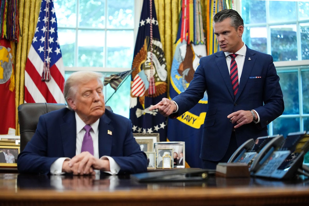 Trump defends Hegseth as secretary faces questions over Venezuela boat strike ‘war crime’: Live