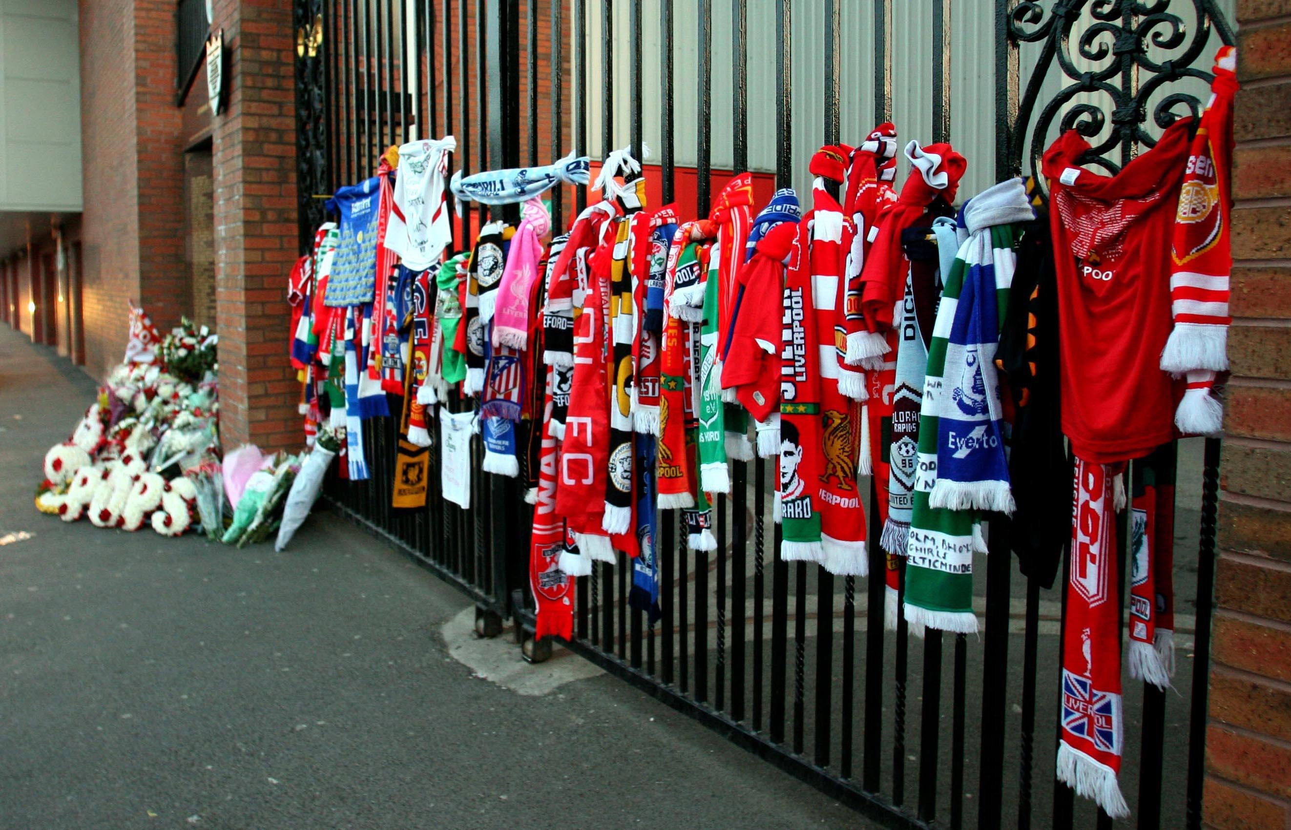 Football scarves from all over the world are tied next to the Hillsborough Memorial, honouring the 97 Liverpool supporters killed (Peter Byrne/PA)