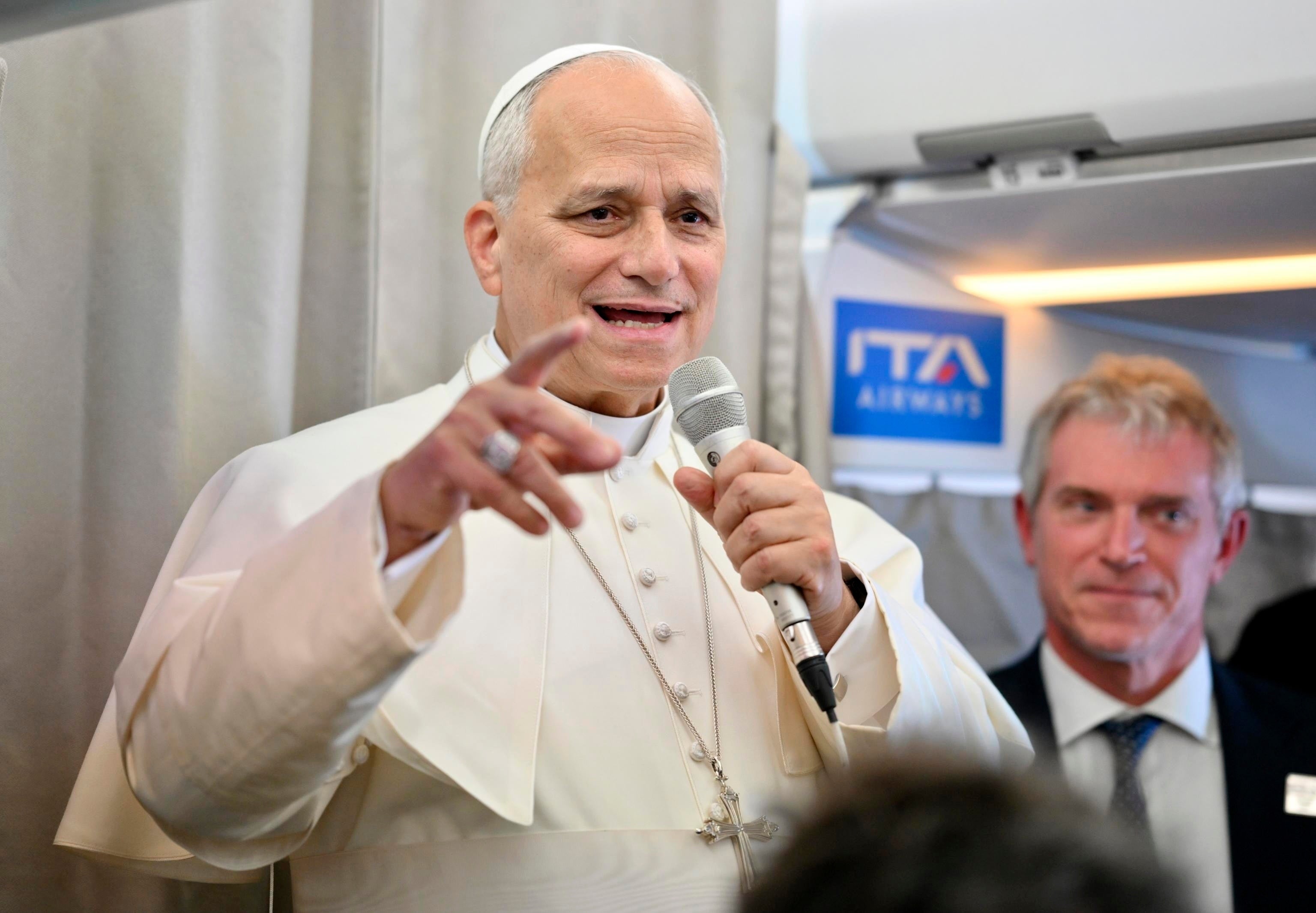 Pope Leo talking to reporters on his flight home from Lebanon