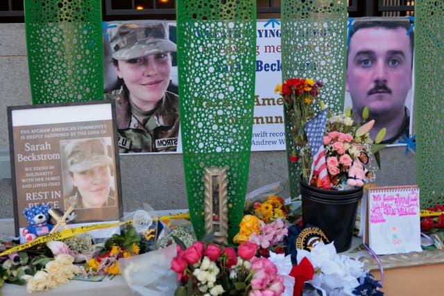 <p>A makeshift memorial in Washington, DC honors Sarah Beckstrom and Andrew Wolfe, the two West Virginia National Guard troops shot blocks from the White House. Beckstrom was killed and Wolfe remains in a serious condition</p>