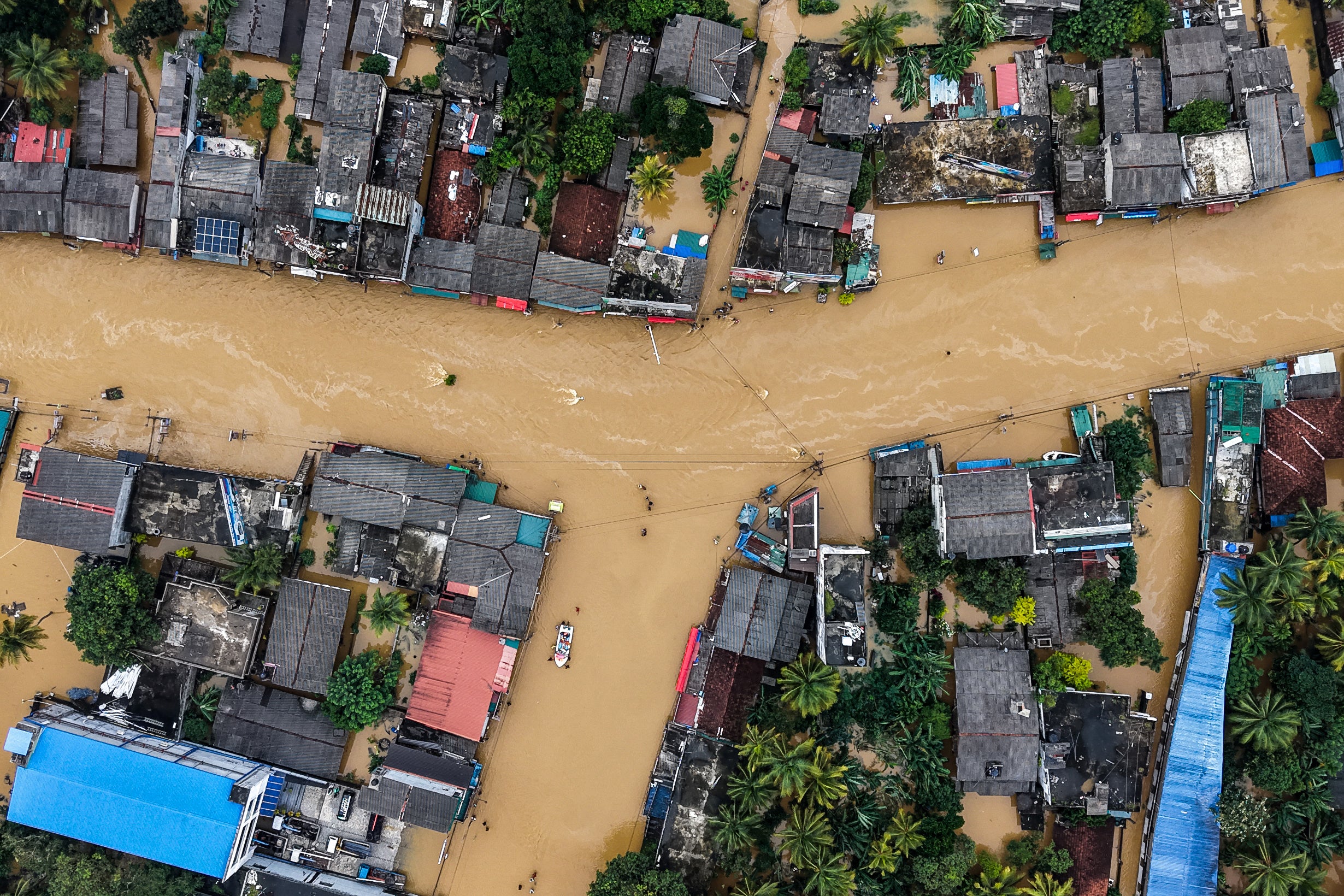 An aerial view shows houses partially submerged in floodwaters after heavy rainfall in Kaduwela on the outskirts of Colombo on November 29, 2025