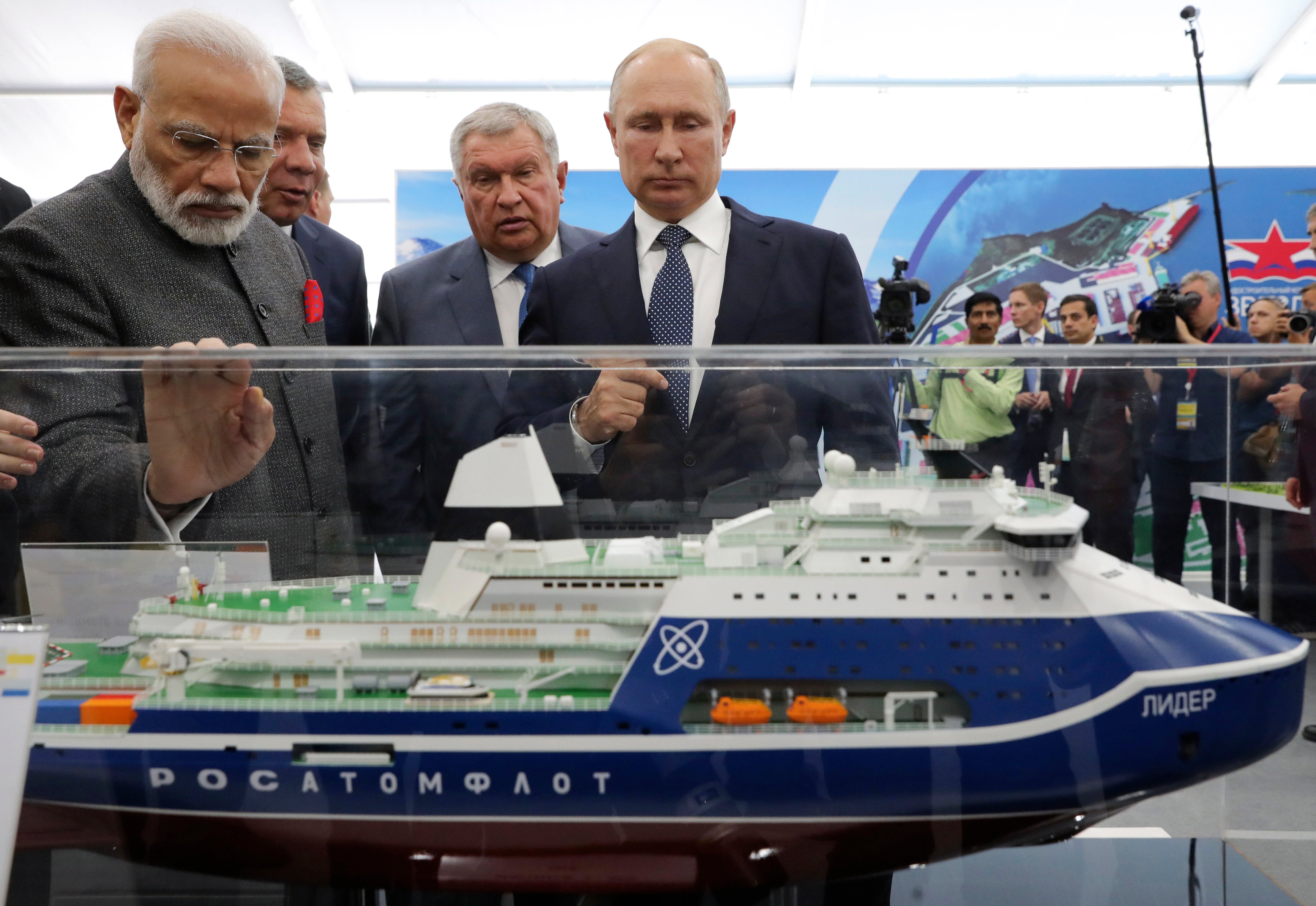 <p>Russian President Vladimir Putin, right, and Indian Prime Minister Narendra Modi, left, look at a model of a Leader nuclear-powered icebreaker as they visit the Zvezda shipyard in the town of Bolshoi Kamen, Russia, on Sept. 4, 2019</p>