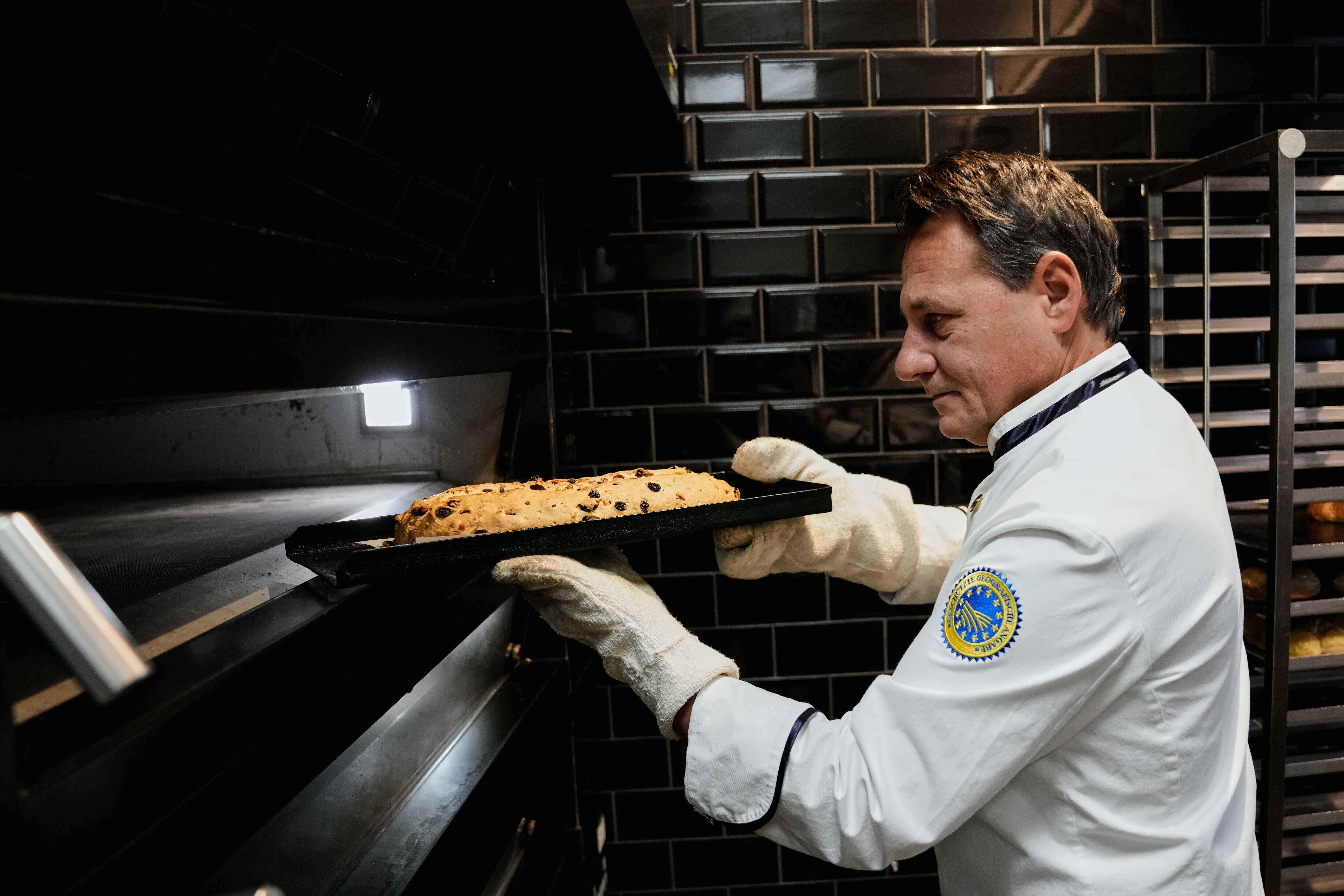 Pastry chef Tino Gierig makes stollen a traditional Christmas pastry in Dresden, Germany.