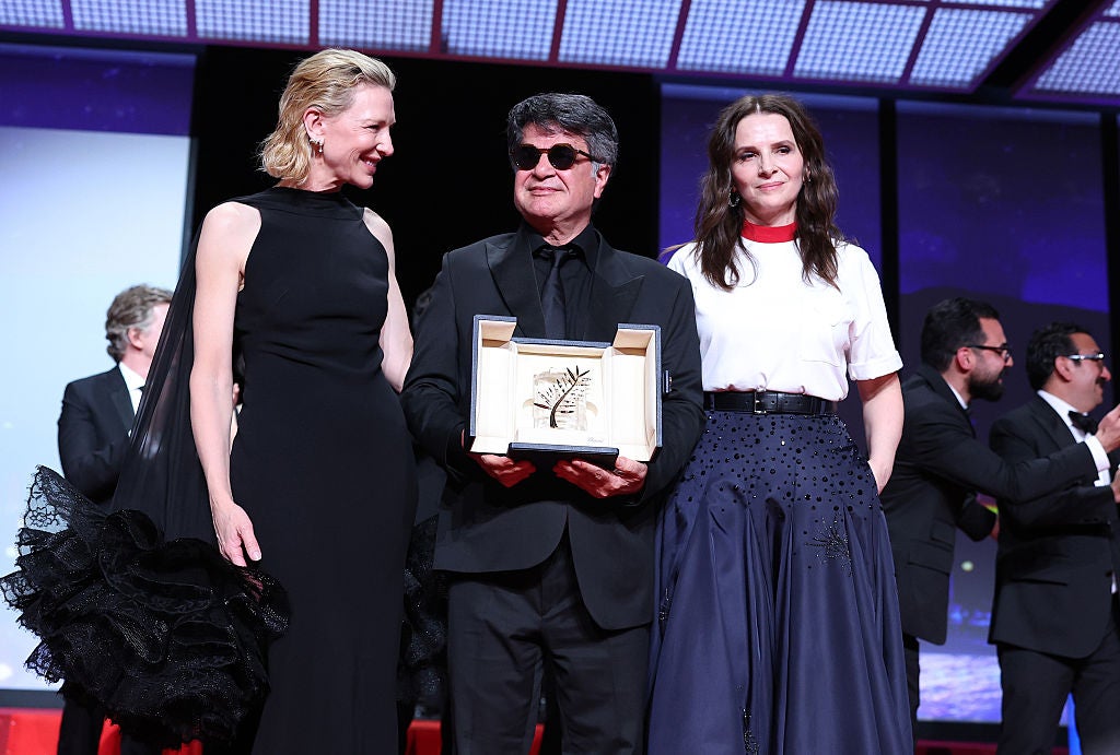Cate Blanchett and Juliette Binoche present Panahi with the Palme d’Or at the Cannes Film Festival in May