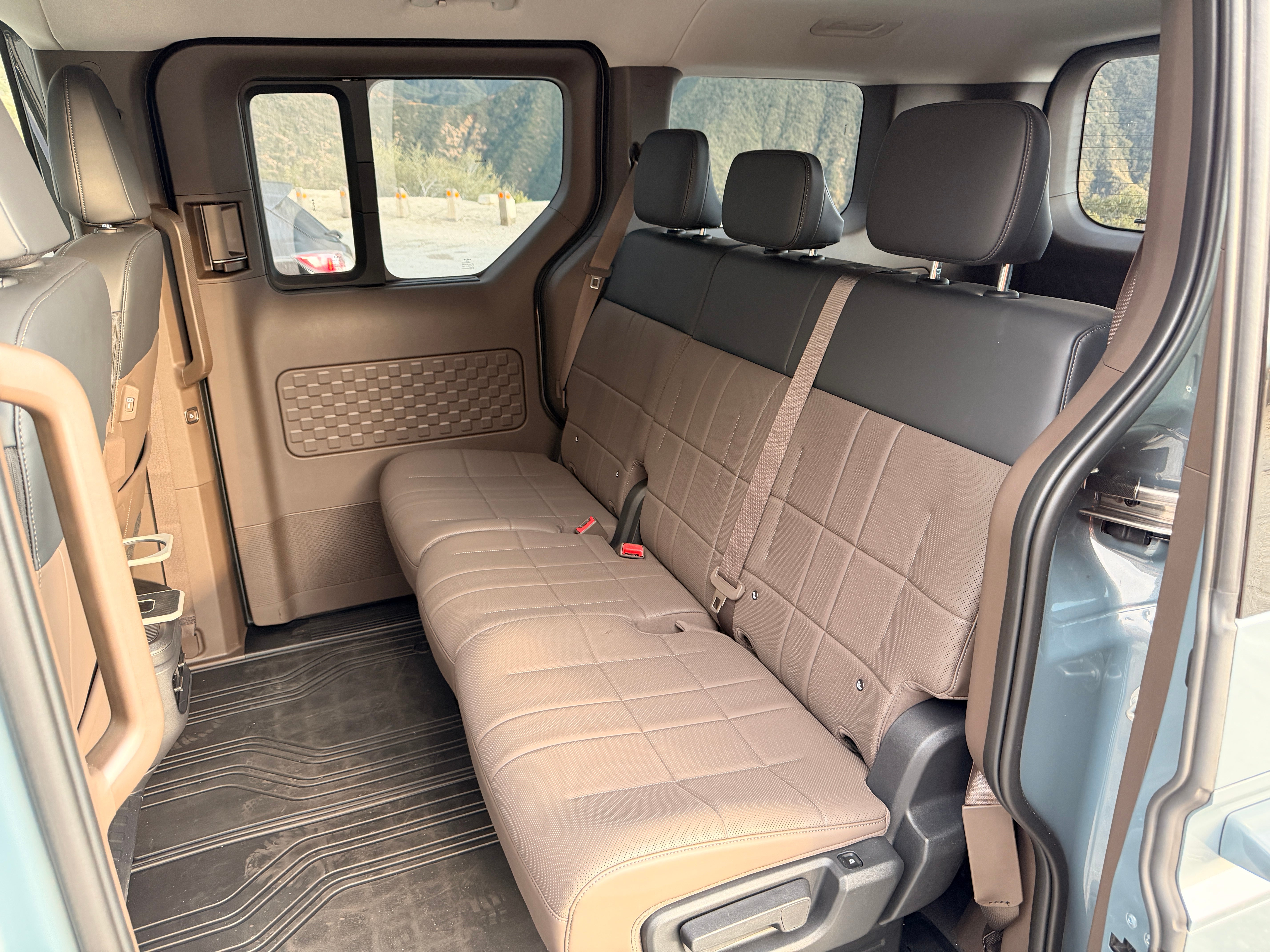 Behind the electrically-sliding side door of the Kia PV5are three easy to access, spacious and comfortable rear seats