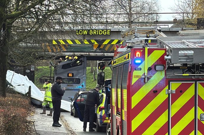 The roof of the bus was ripped off after it hit the bridge