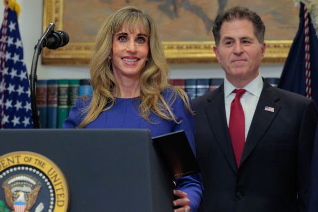 <p>Susan and Michael Dell at the White House</p>