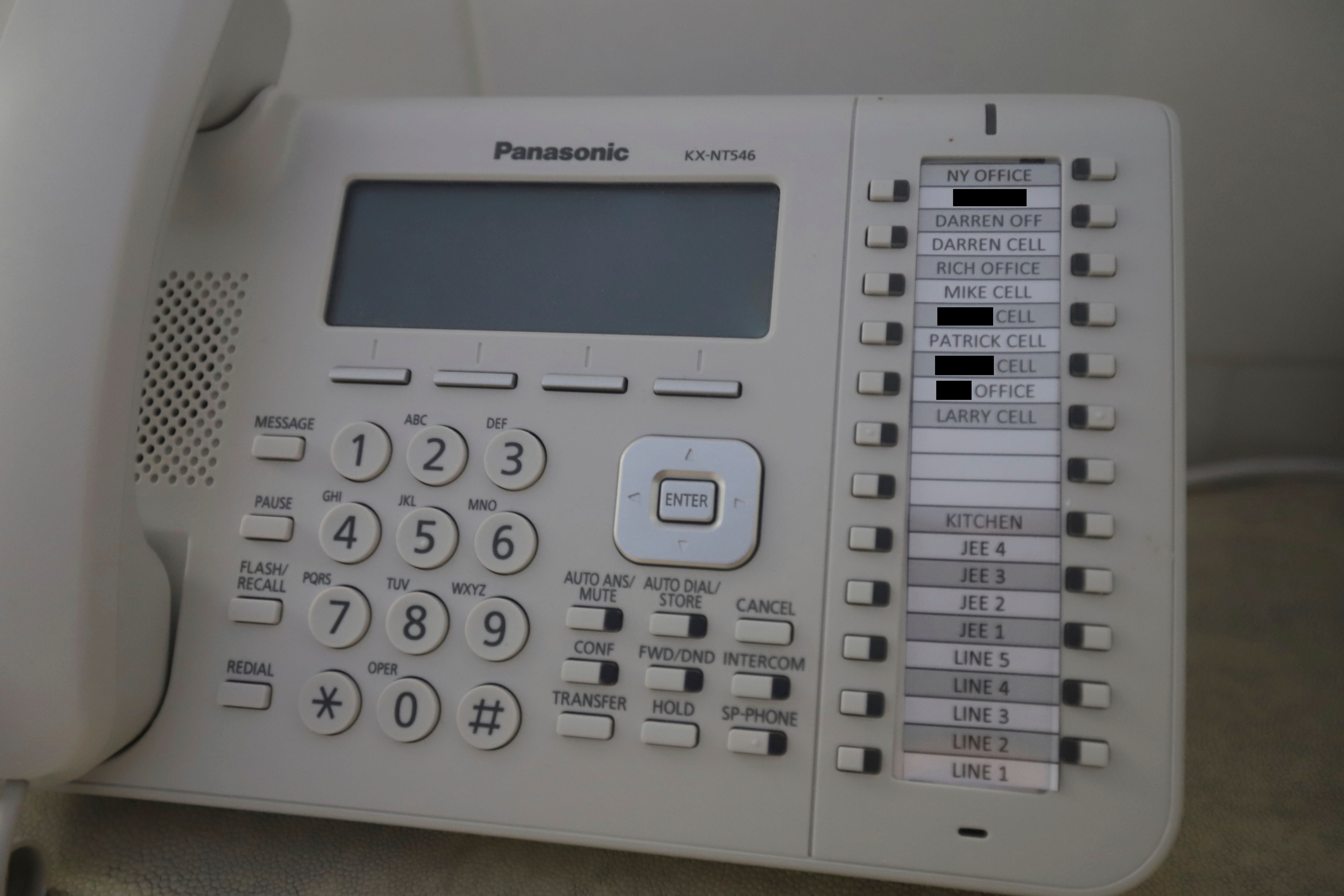 A landline telephone, photographed inside Jeffrey Epstein's home, features several names on speed dial