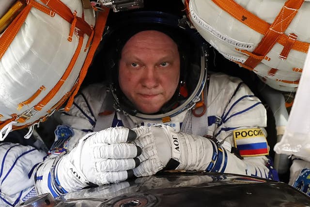 <p>Roscosmos cosmonaut Oleg Artemyev inside the Soyuz MS-08 space capsule after landing in a remote area outside the town of Dzhezkazgan, Kazakhstan, on 4 October, 2018</p>