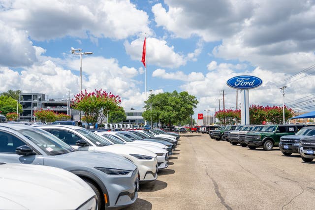 <p>Ford Mustang Mach-E vehicles are seen for sale on a dealership lot on June 24, 2025 in Austin, Texas</p>