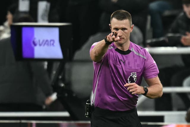 <p>Referee Thomas Bramall indicates a penalty to Newcastle after a VAR review</p>