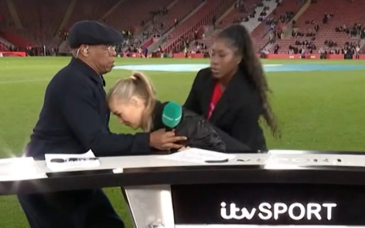 Laura Woods is caught by Ian Wright after falling while on air