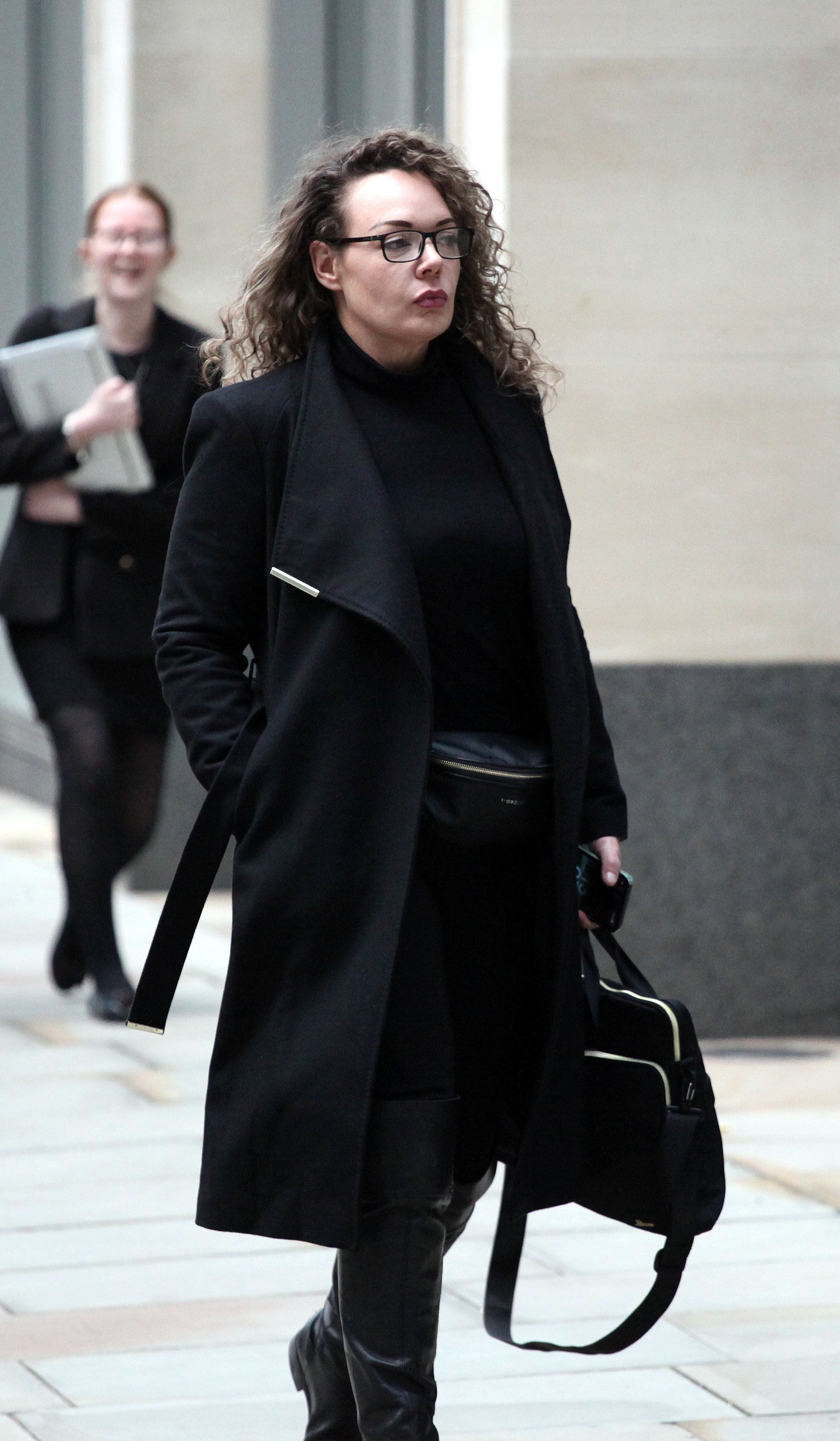 Picture shows Emma McDaniel outside London's High Court during a will fight with her stepmother
