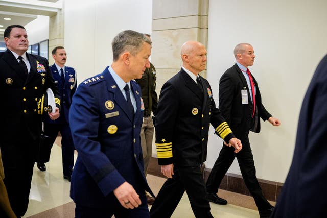 <p>Navy Adm. Frank Bradley (2nd-R), accompanied by Chairman of the Joint Chiefs of Staff Air Force Gen. Dan Caine (3rd-L), arrives for a closed door classified meeting with lawmakers on Capitol Hill on December 4, 2025 in Washington, DC</p>