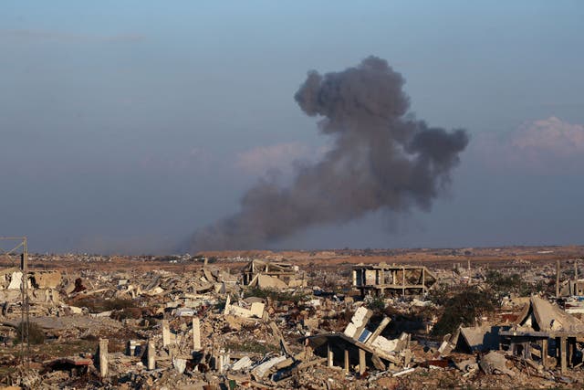 <p>This picture taken from the Nuseirat camp for displaced Palestinians shows destroyed buildings and smoke billowing in the distance following Israeli strikes east of Gaza City on December 2, 2025</p>