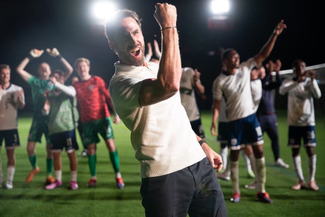 <p>In the pictures, Fiennes can be seen celebrating with his players after England reached the 2024 European Championships final, wearing a white polo shirt and black trousers.</p>