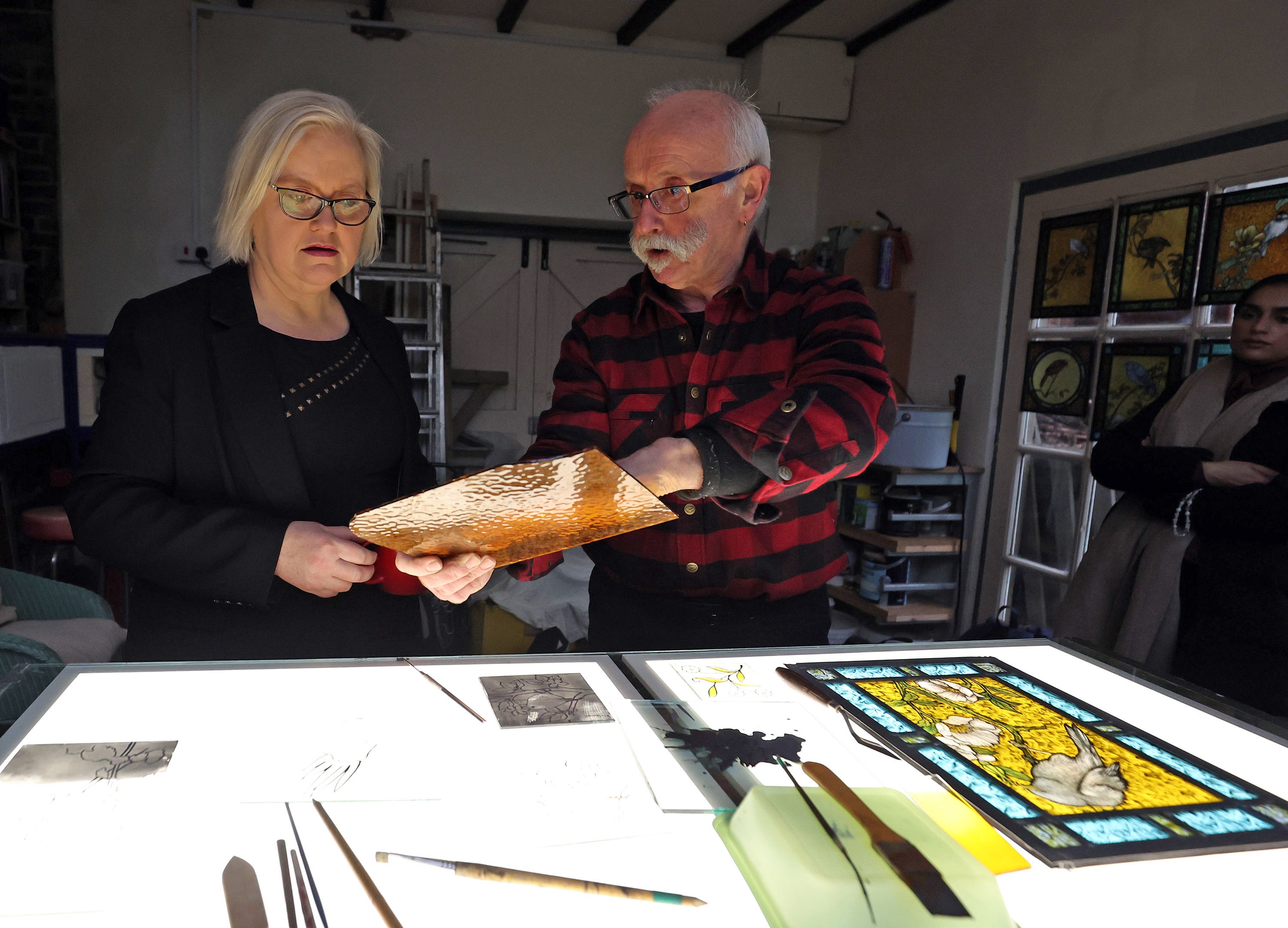 Baroness Fiona Twycross meets Phil Crook, a stained glass craftsman, at his workshop in Ulgham, Northumberland, to mark the opening of public submissions to the new 'Living Heritage inventories', where communities across the UK can submit their heritage traditions and practices as part of a nationwide living heritage stocktake