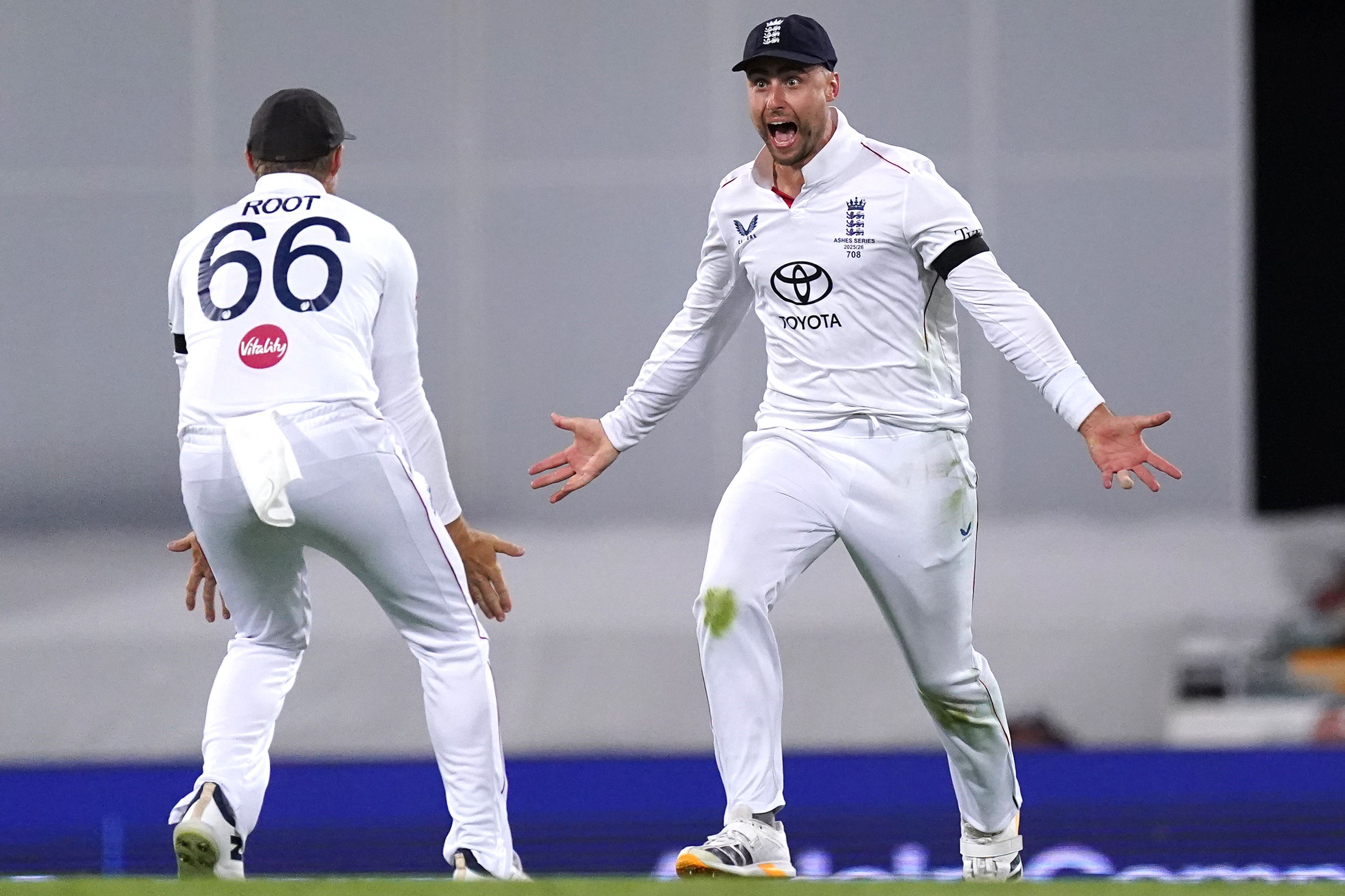 England’s Will Jacks, right, celebrates with Joe Root after catching out Steve Smith (Robbie Stephenson/PA)