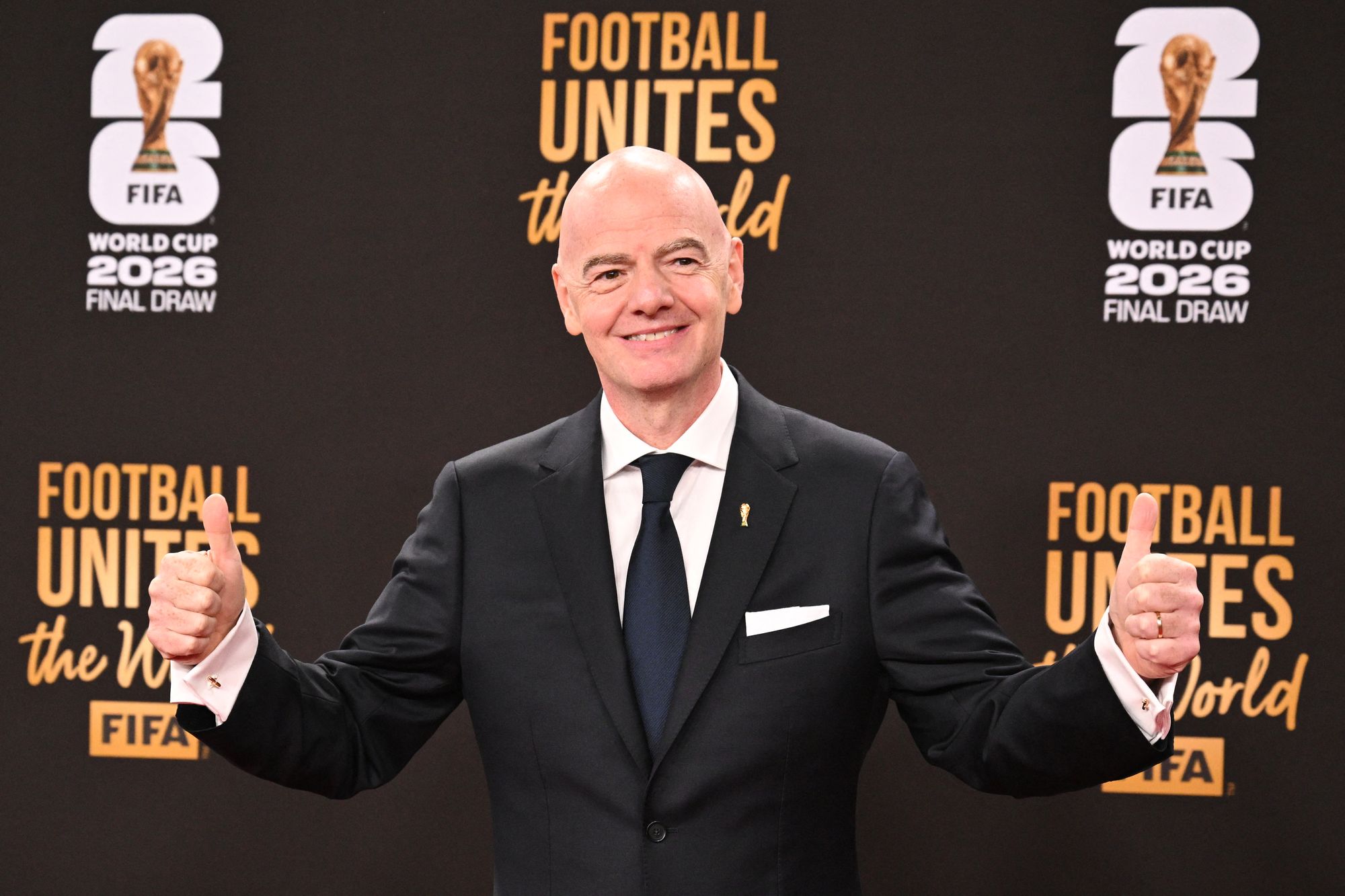 <p> Fifa President Gianni Infantino poses on the red carpet ahead of the draw</p>
