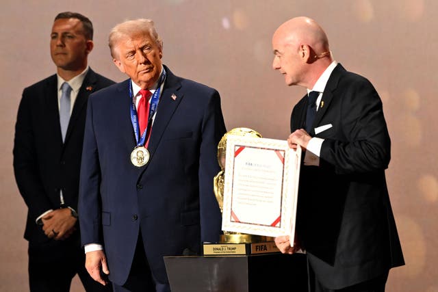 <p>Gianni Infantino presents the first Fifa Peace Prize to Donald Trump</p>
